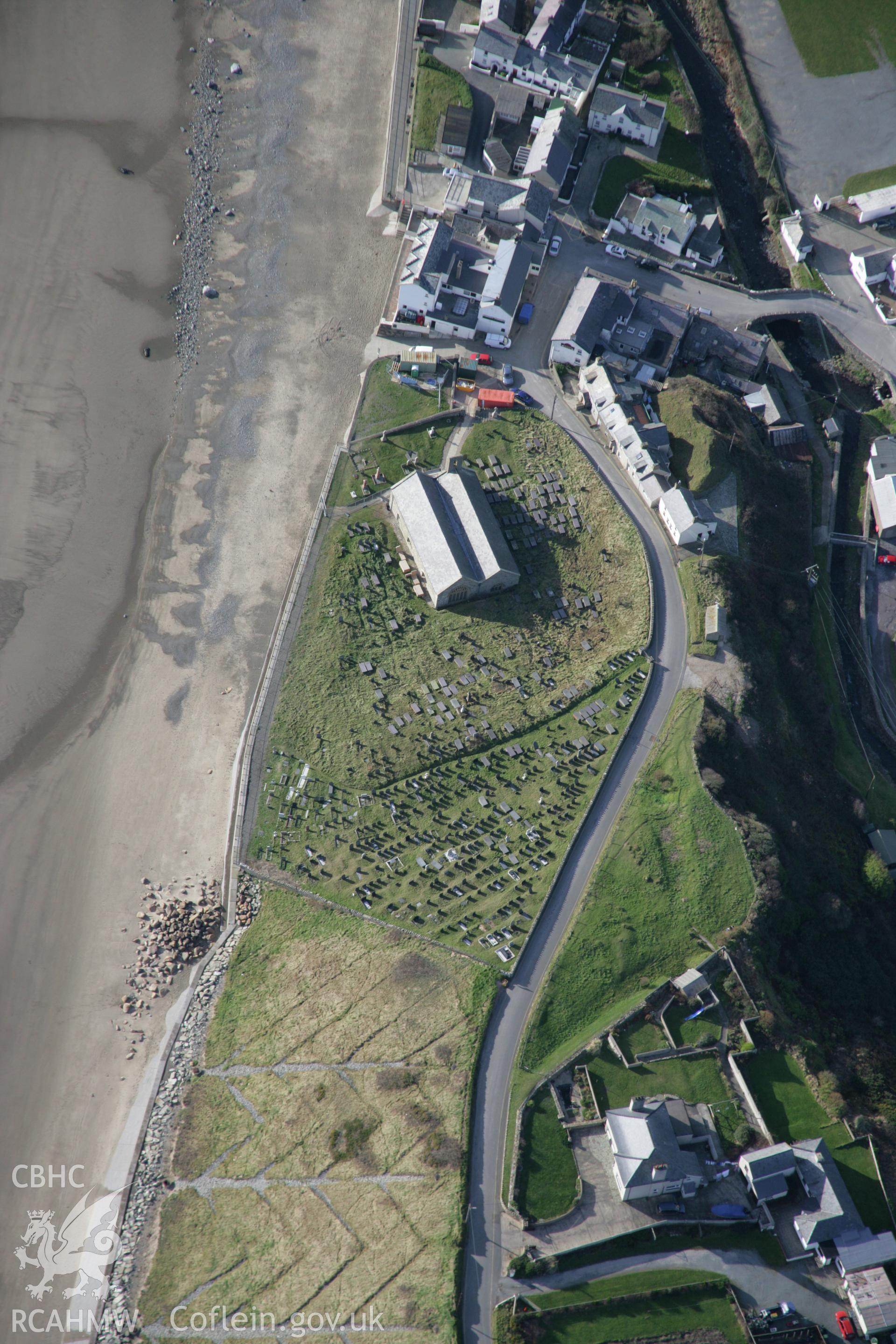 RCAHMW colour oblique aerial photograph of St Hywyns Church, Aberdaron, from the east. Taken on 09 February 2006 by Toby Driver.