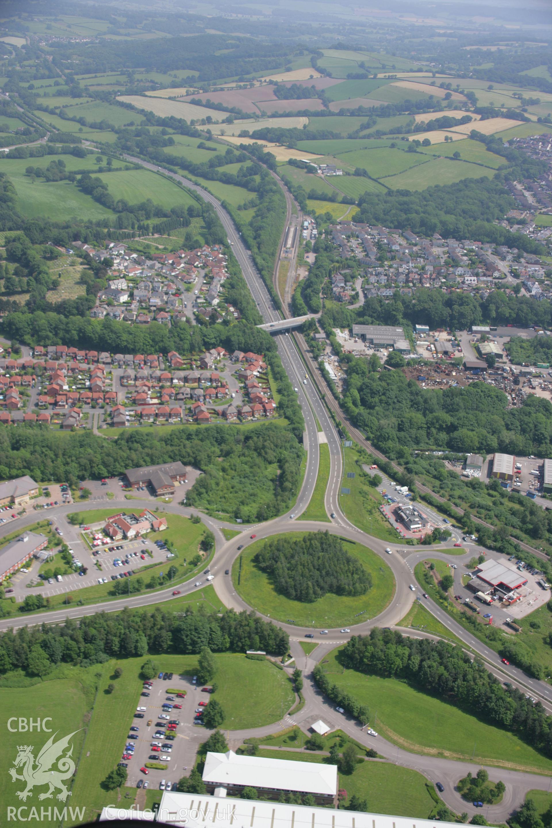 RCAHMW colour oblique aerial photograph of Pontypool from the south-west showing roundabouts and the suburbs. Taken on 09 June 2006 by Toby Driver.