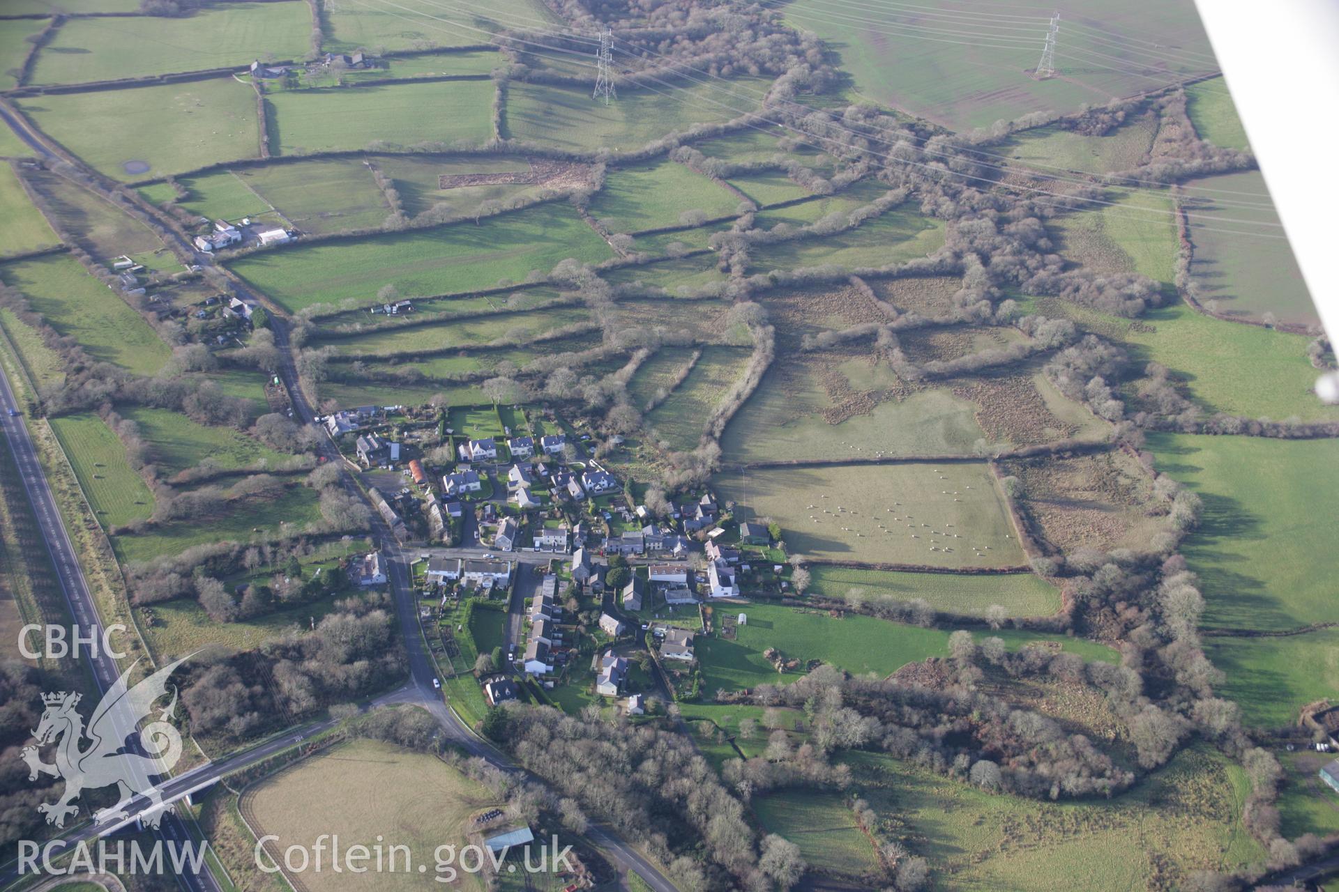 RCAHMW colour oblique aerial photograph of Redberth Village viewed from the east showing strip fields. Taken on 11 January 2006 by Toby Driver