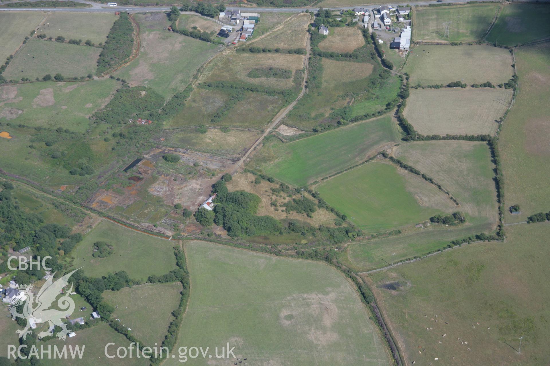 RCAHMW colour oblique aerial photograph of Dyffryn Adda Reverbatory Furnace, Parys Mountain. Taken on 14 August 2006 by Toby Driver.