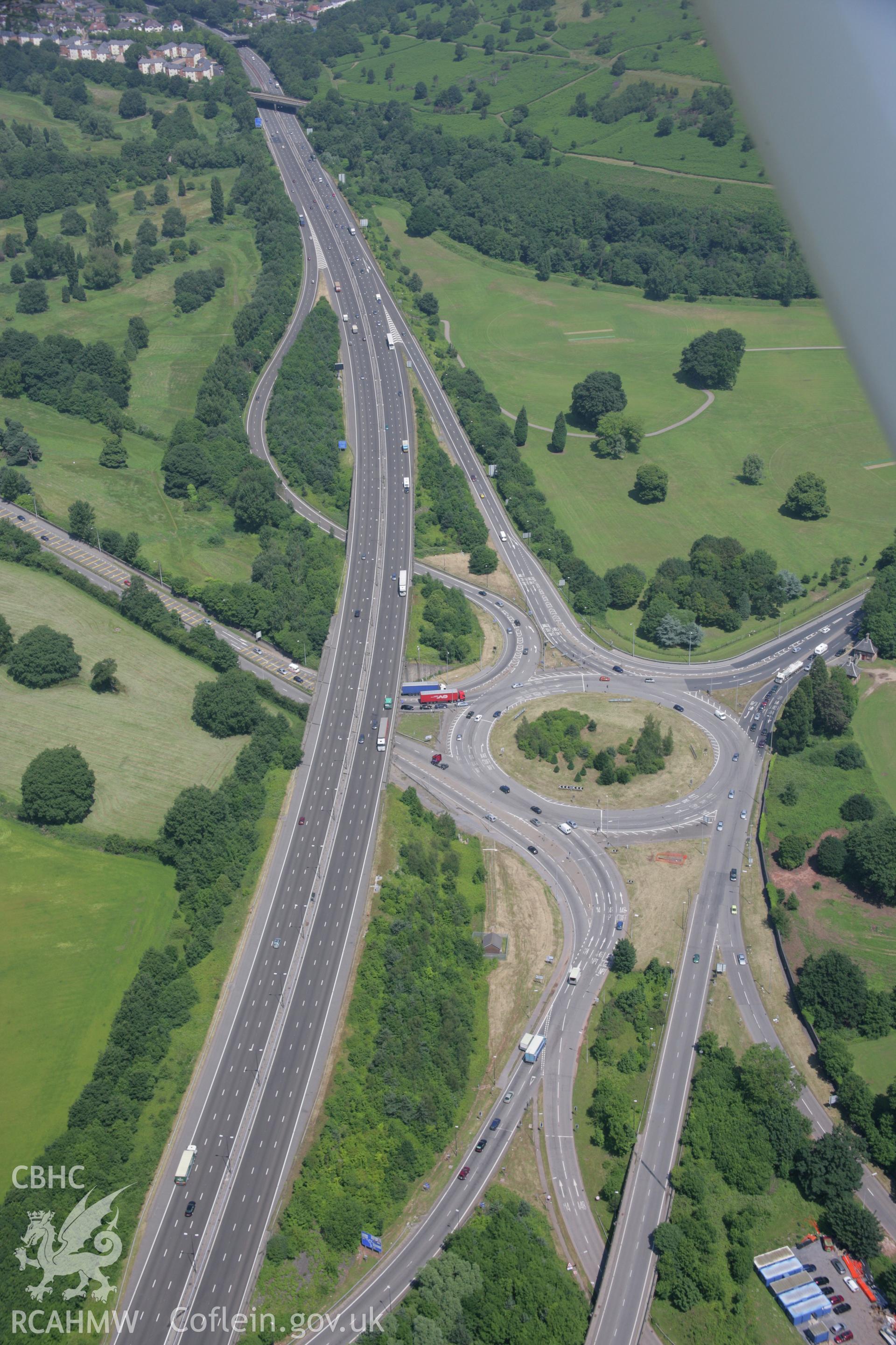 RCAHMW colour oblique photograph of Tredegar motorway junction and Tredegar House Gatelodges. Taken by Toby Driver on 29/06/2006.