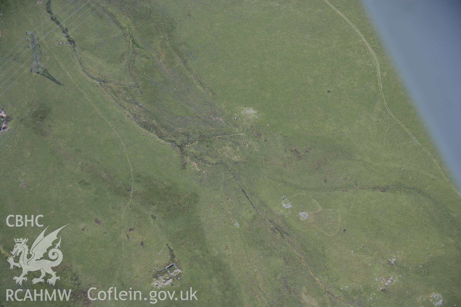 RCAHMW colour oblique aerial photograph of a hut circle at Graig Wen. Taken on 18 July 2006 by Toby Driver.