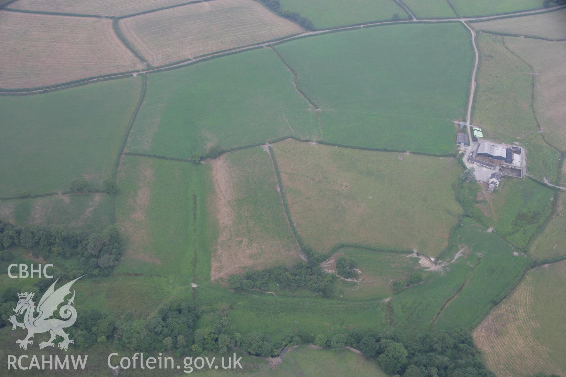 RCAHMW colour oblique aerial photograph of a cropmark enclosure south of Blaen-Lliwe. Taken on 21 July 2006 by Toby Driver.