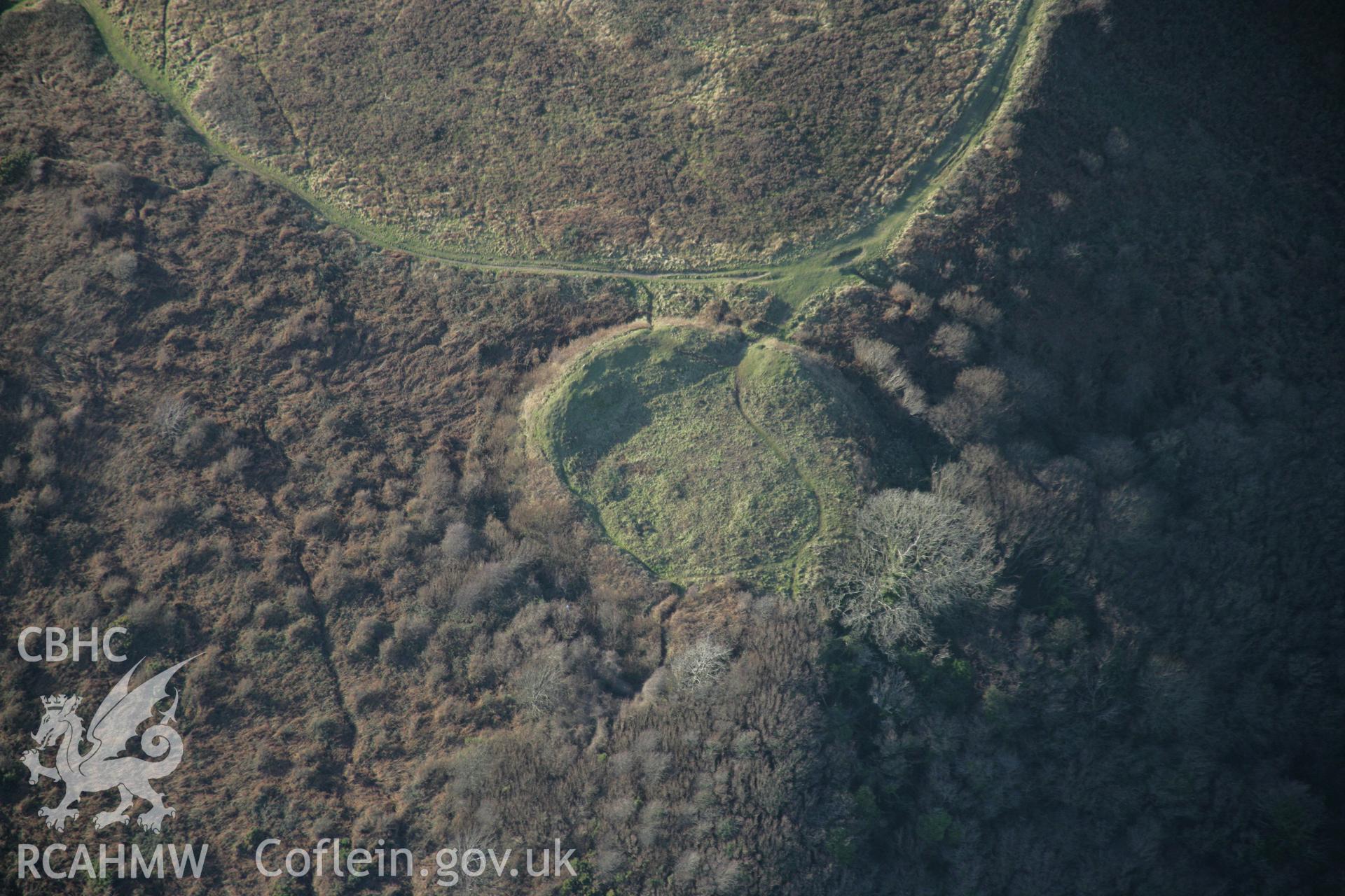 RCAHMW colour oblique aerial photograph of Castle Tower, Penmaen Burrows ringwork, viewed from the south-east. Taken on 26 January 2006 by Toby Driver