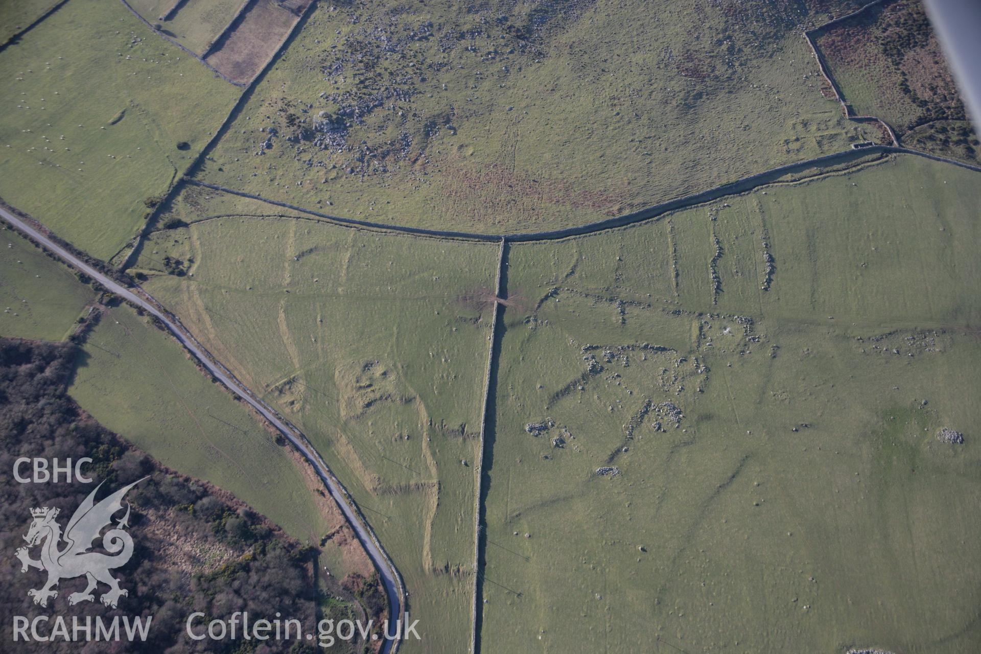 RCAHMW colour oblique aerial photograph of Garn Bach, Pen y Caerau, hut groups and field systems, viewed from the south-east. Taken on 09 February 2006 by Toby Driver