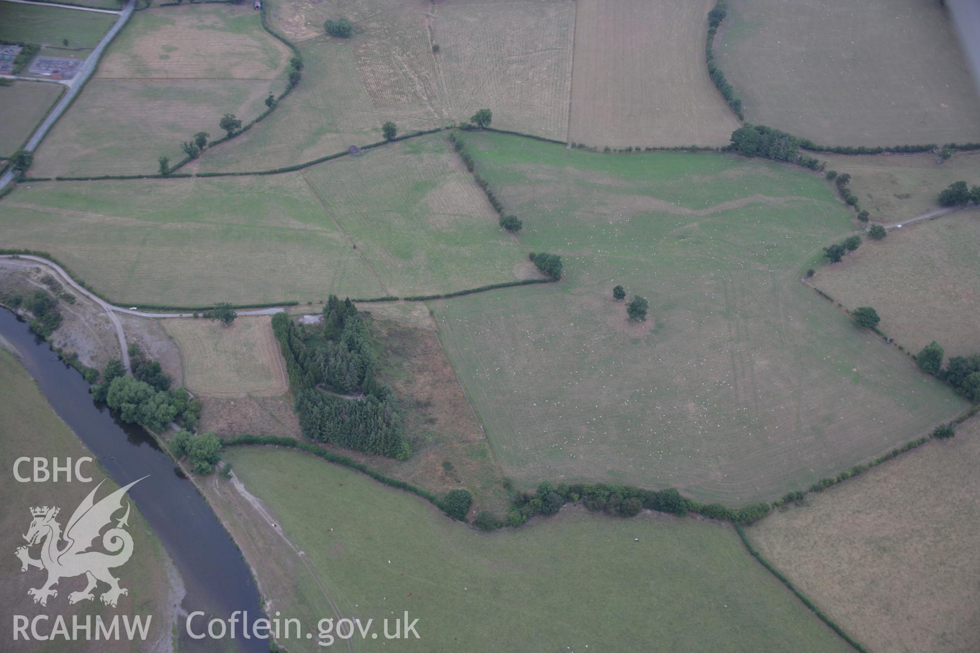 RCAHMW colour oblique aerial photograph showing parchmarks in grass at Llwyn-y-Brain Roman Fort. Taken on 14 August 2006 by Toby Driver.