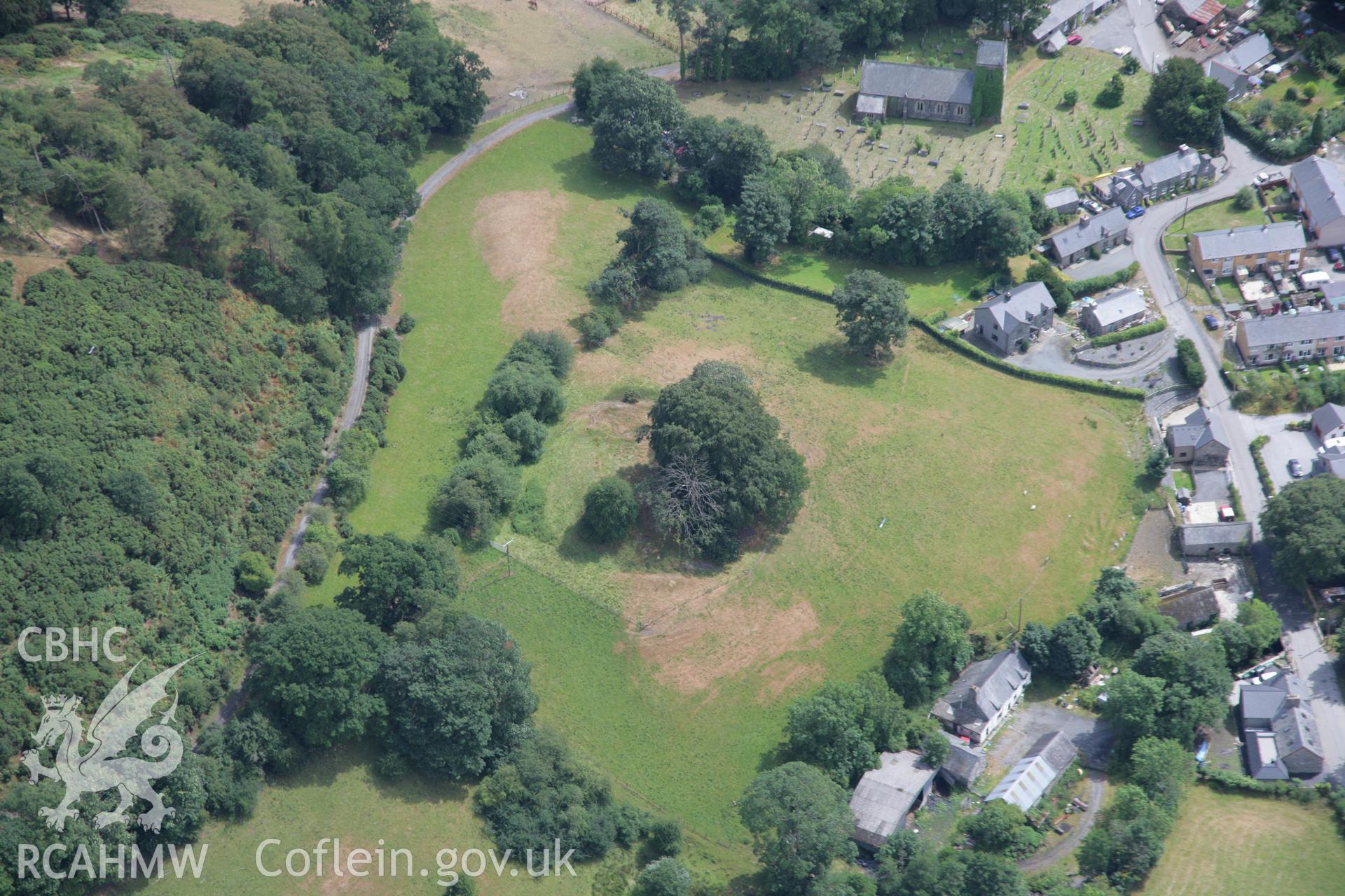 RCAHMW colour oblique aerial photograph of Pen Ucha'r Llan Castle Earthworks. Taken on 31 July 2006 by Toby Driver