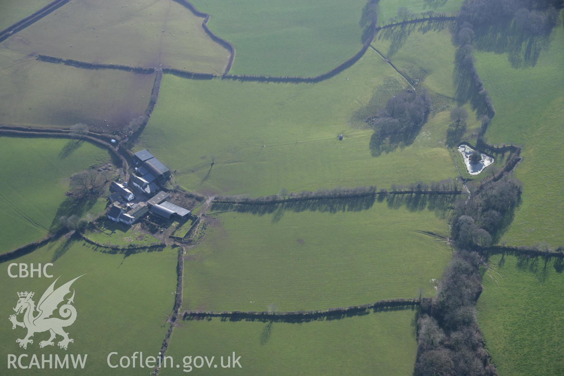 RCAHMW colour oblique aerial photograph of Meinillwydion Standing Stone Pair and field earthworks, Llandyfaelog, Pentre, viewed from the north. Taken on 26 January 2006 by Toby Driver