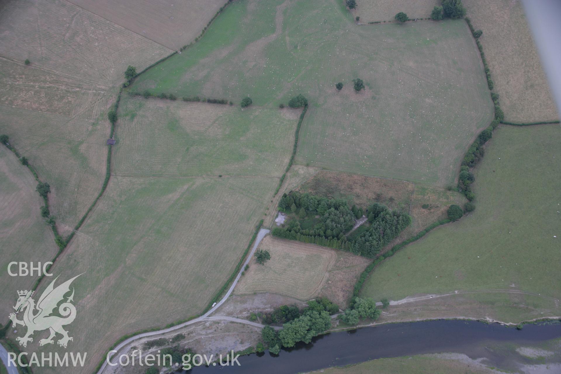 RCAHMW colour oblique aerial photograph showing parchmarks in grass at Llwyn-y-Brain Roman Fort. Taken on 14 August 2006 by Toby Driver.