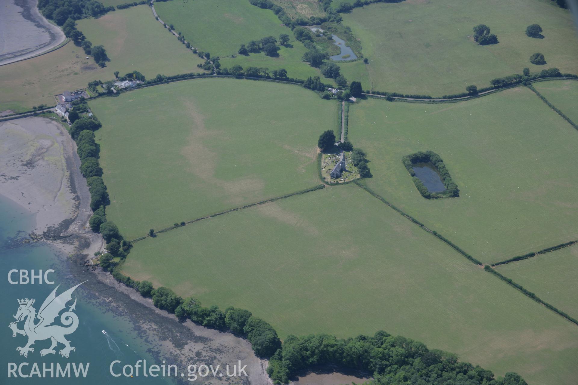 RCAHMW colour oblique aerial photograph of St Edwen's Church, Llanedwen. Taken on 18 July 2006 by Toby Driver.