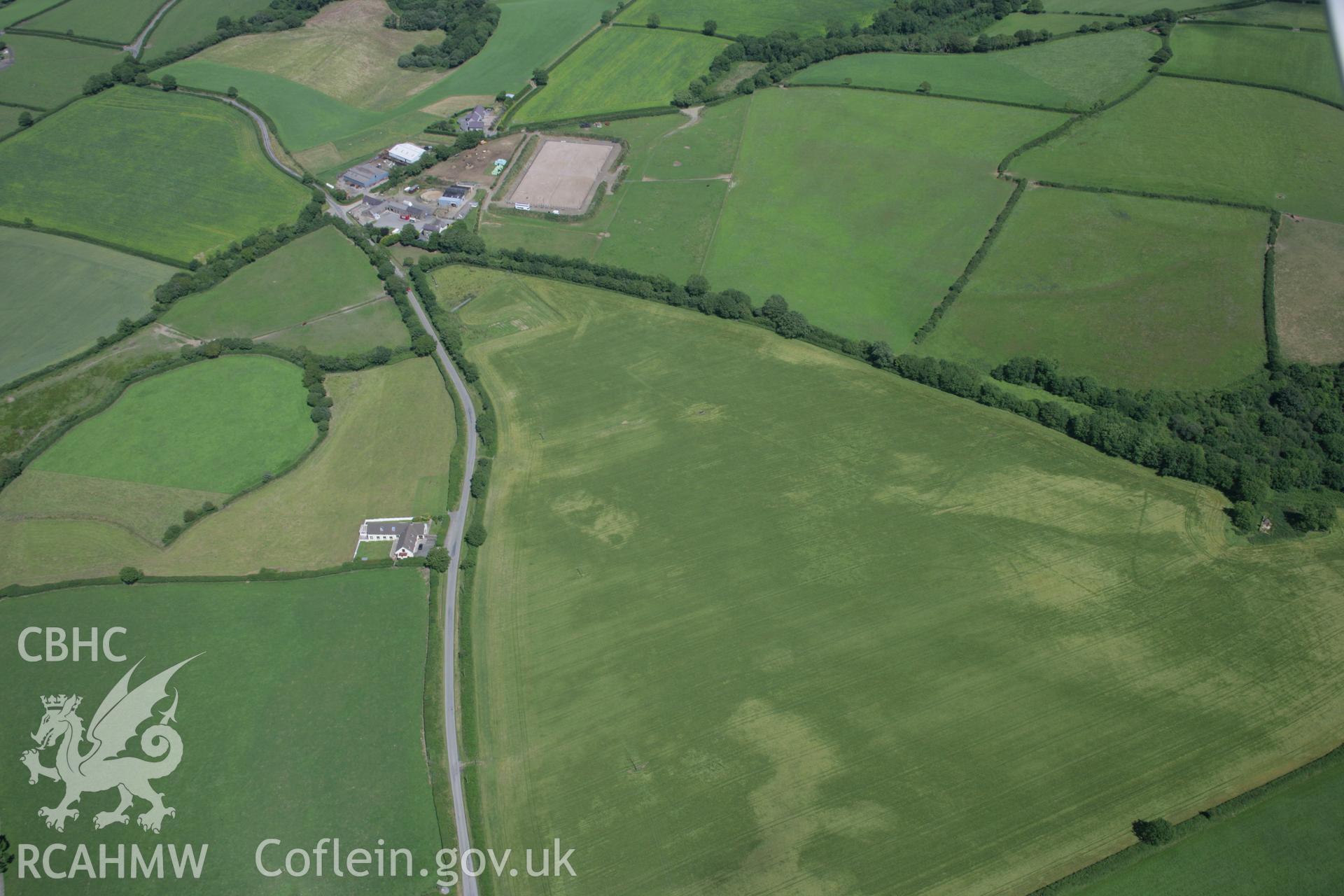 RCAHMW colour oblique aerial photograph of the Roman road west of Carmarthen at Broadway with the road showing as a cropmark. Taken on 11 July 2006 by Toby Driver.