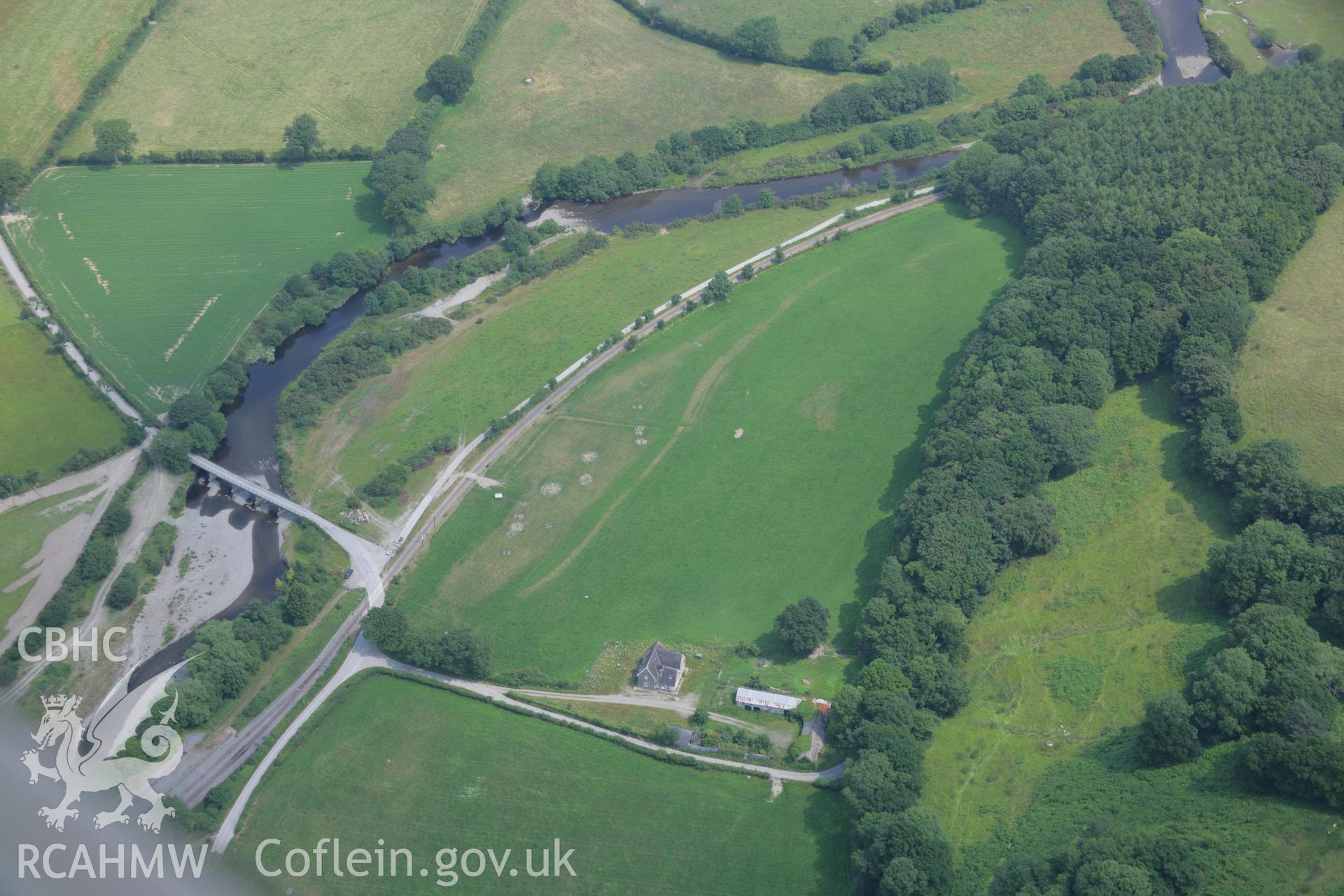 RCAHMW colour oblique aerial photograph showing square parchmarks, Rhiwarthen near Capel Bangor Railway Station. Taken on 04 July 2006 by Toby Driver.