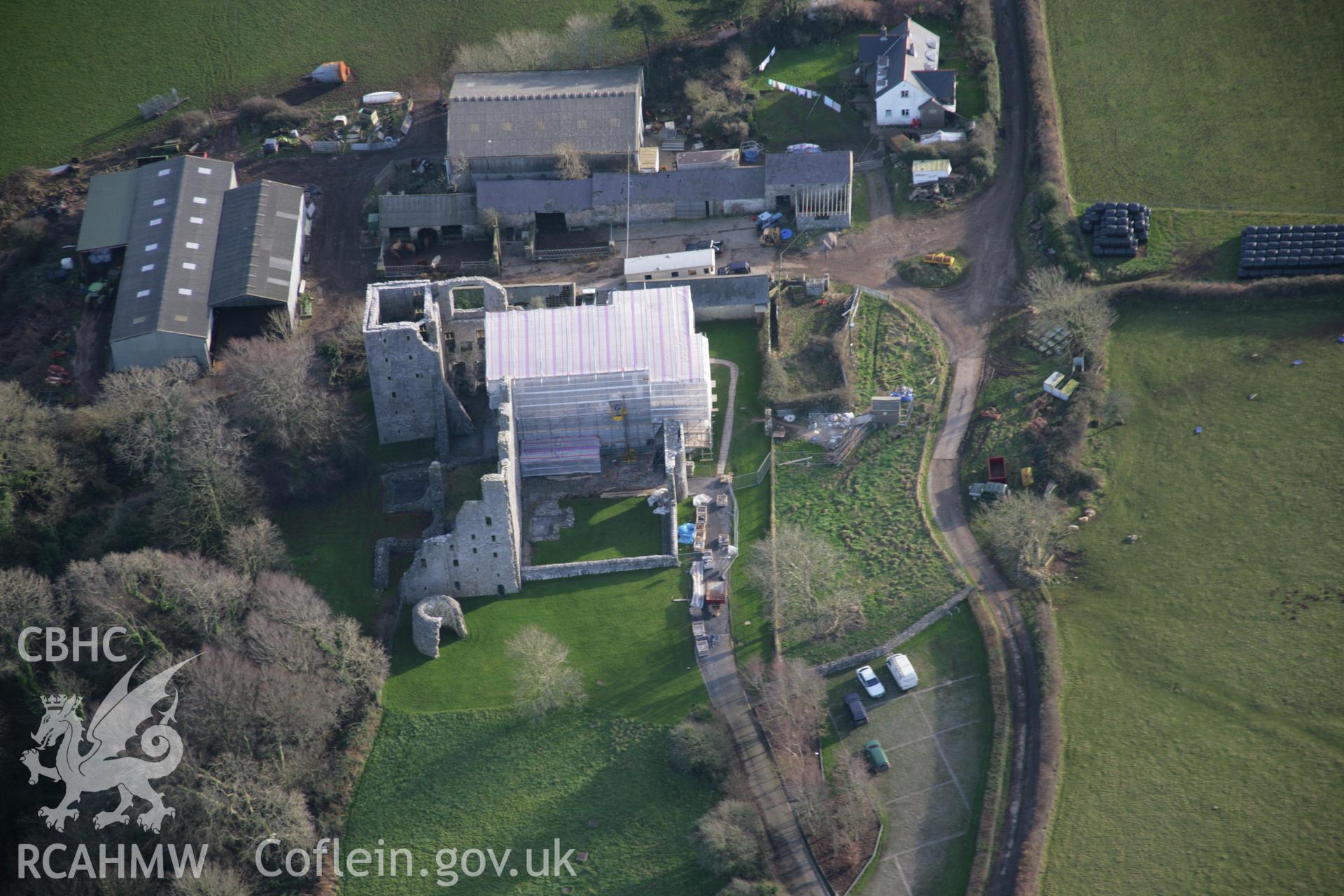 RCAHMW colour oblique aerial photograph of Oxwich Castle, with restoration in progress, in wide view from the north-west. Taken on 26 January 2006 by Toby Driver.