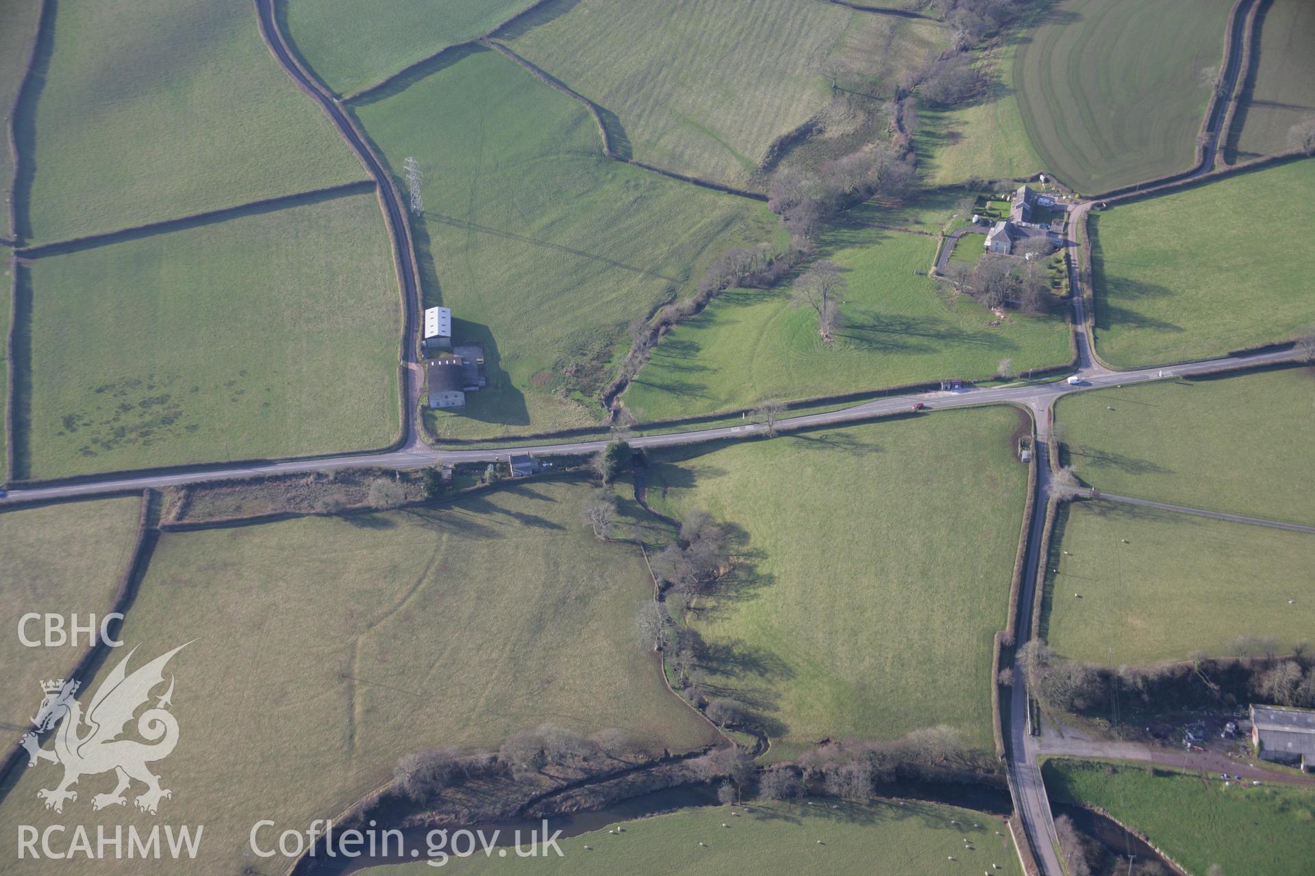 RCAHMW colour oblique aerial photograph of Glanmorlais Bridge. A view from the east with earthworks of leats and field drains visible. Taken on 26 January 2006 by Toby Driver.