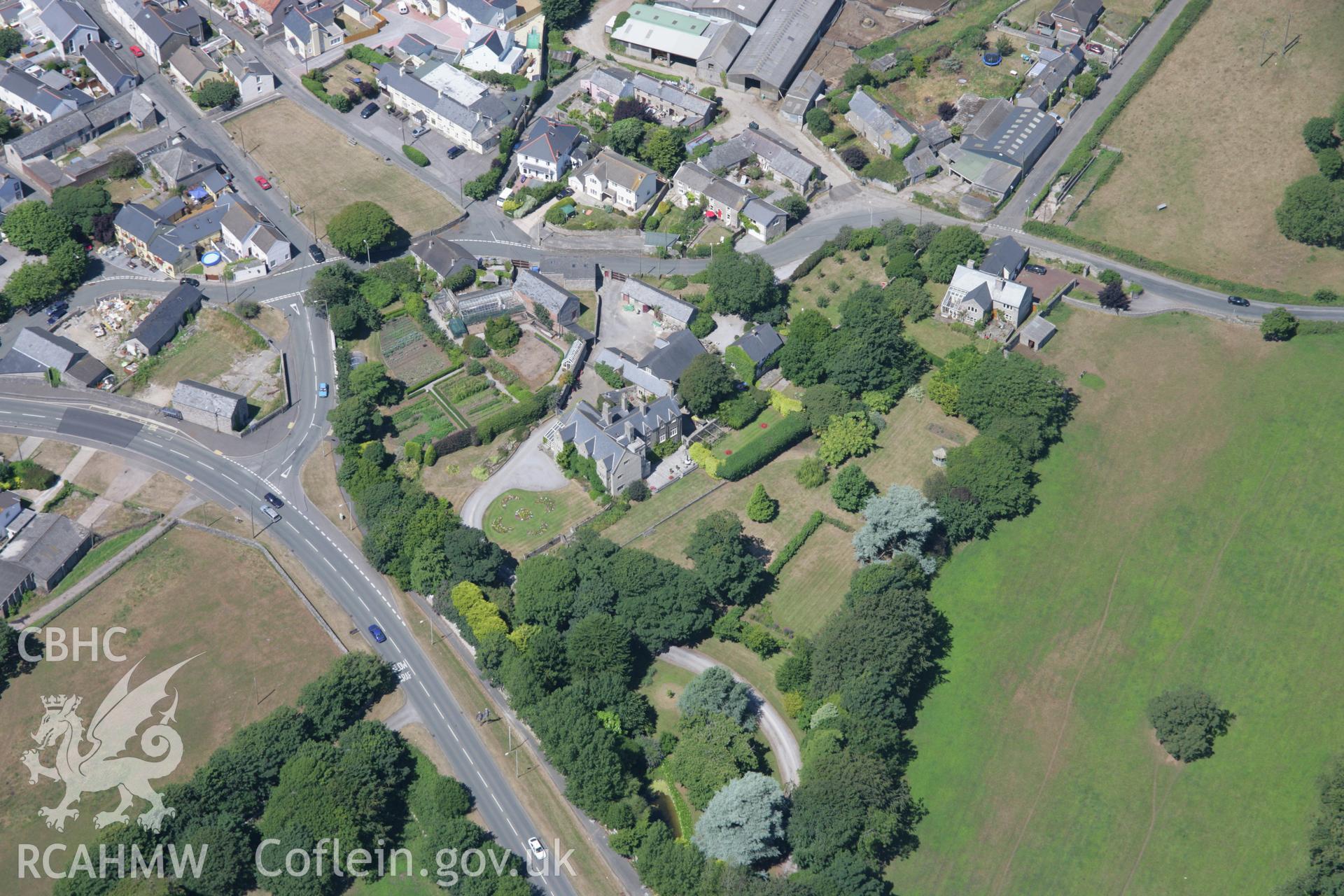 RCAHMW colour oblique aerial photograph of Nottage Court Roman Milestone. Taken on 24 July 2006 by Toby Driver.