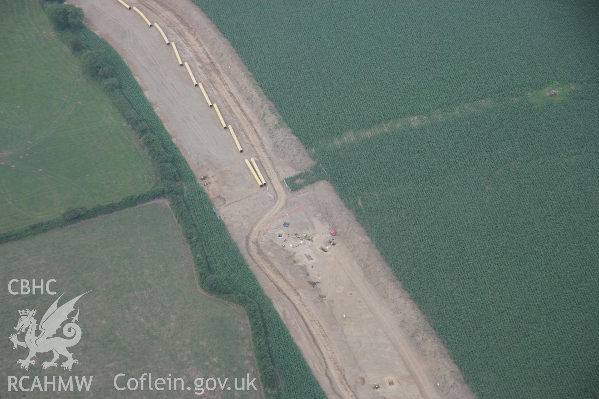 RCAHMW colour oblique aerial photograph of Wiston showing excavations on the route of the gas pipeline. Taken on 21 July 2006 by Toby Driver.