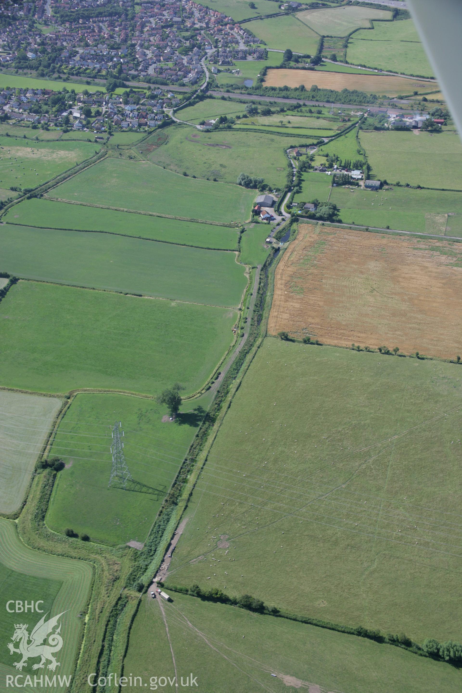 RCAHMW colour oblique aerial photograph of the relict seawall alongside Collister Pill Reen. Taken on 13 July 2006 by Toby Driver.