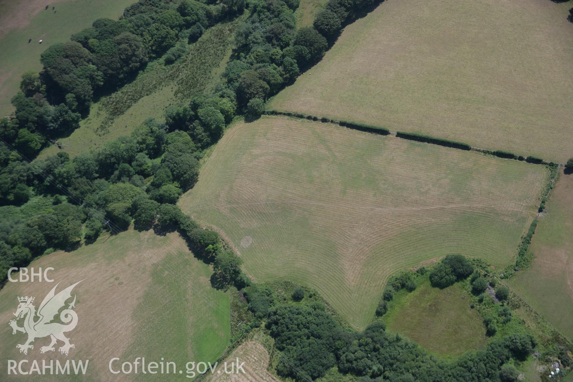 RCAHMW colour oblique aerial photograph of Bwlch y Ffordd Isa cropmark enclosure from the north-west. Taken on 03 August 2006 by Toby Driver.