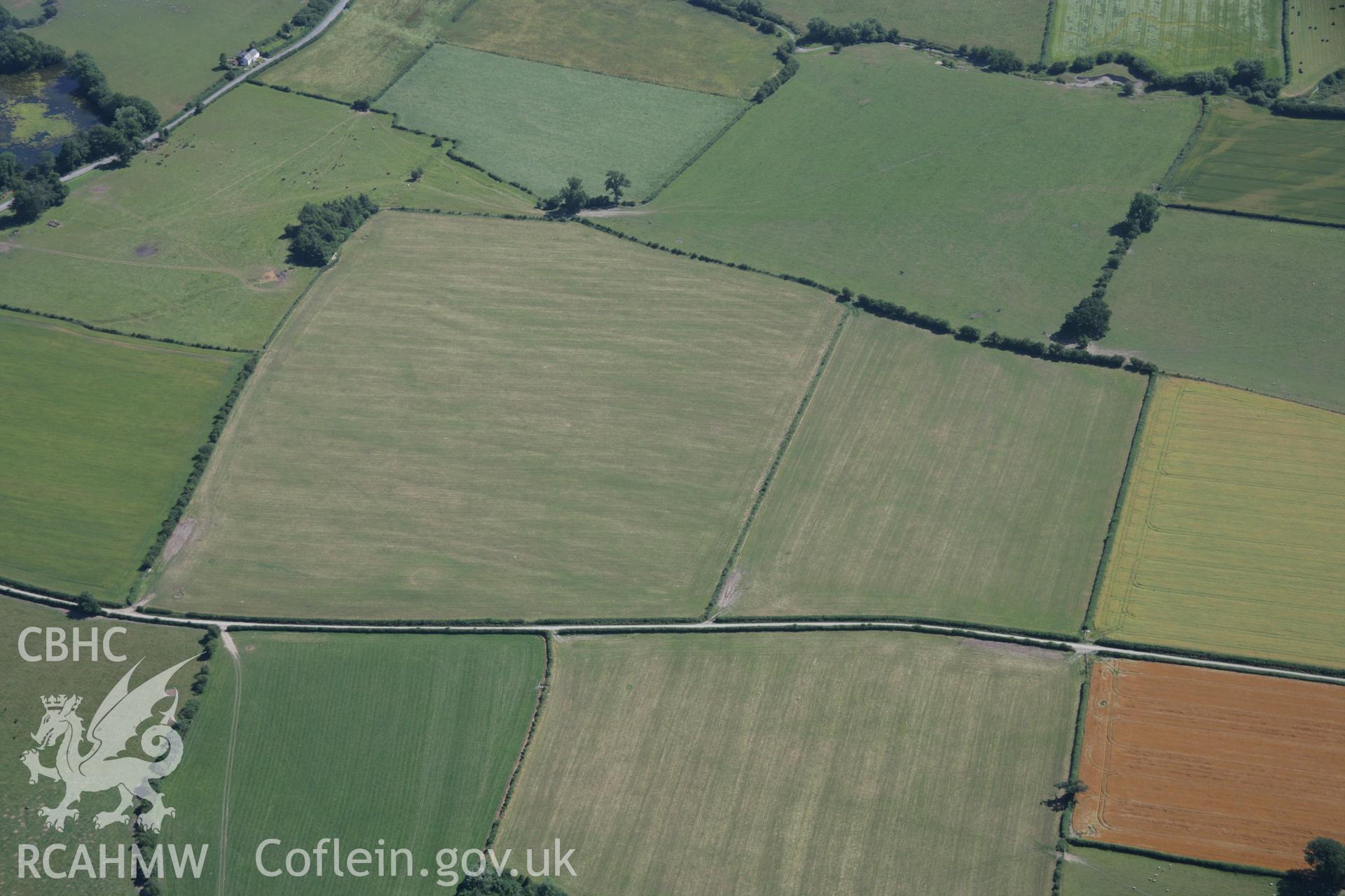 RCAHMW colour oblique aerial photograph of Hindwell Pallisaded Enclosure. Taken on 13 July 2006 by Toby Driver.