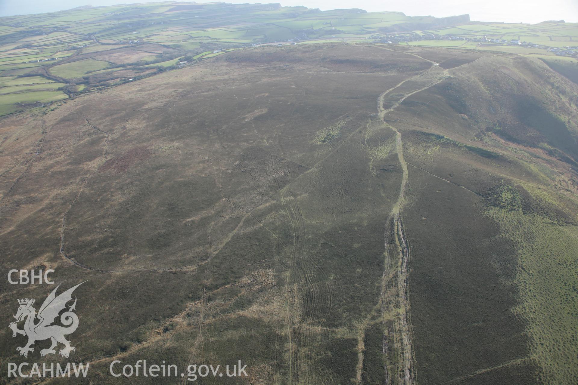 RCAHMW colour oblique aerial photograph of Bessie's Meadow Cairn and Rhossili Down viewed from the north. Taken on 26 January 2006 by Toby Driver.