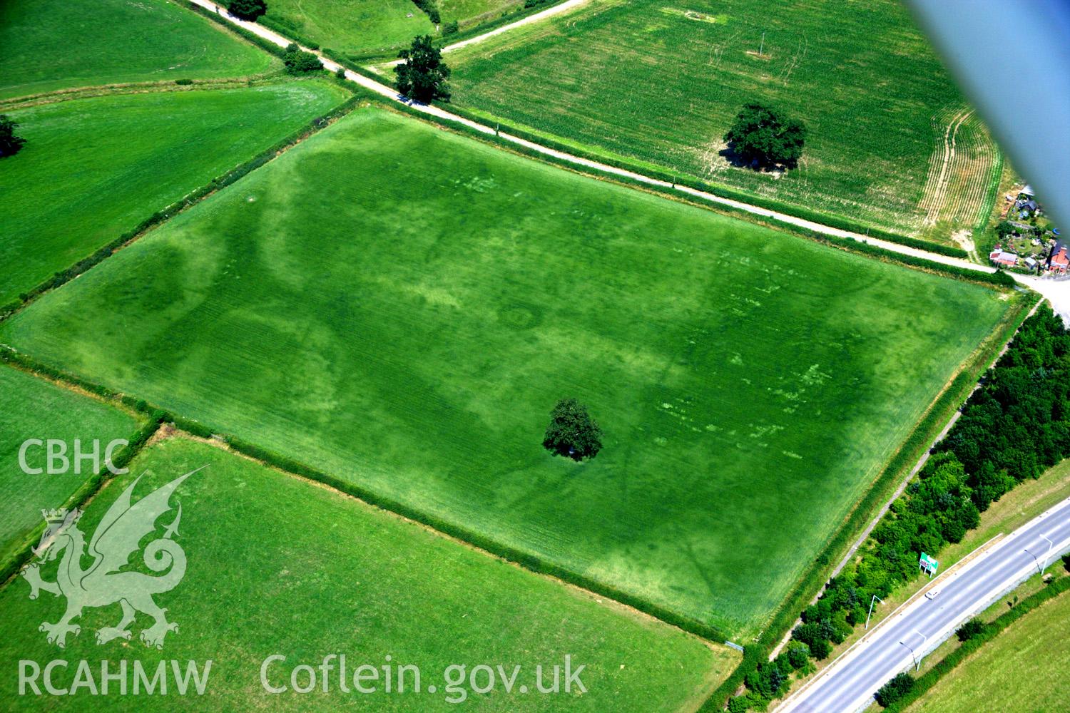 RCAHMW colour oblique aerial photograph of Sarn-y-Bryn Caled. Taken on 04 July 2006 by Toby Driver