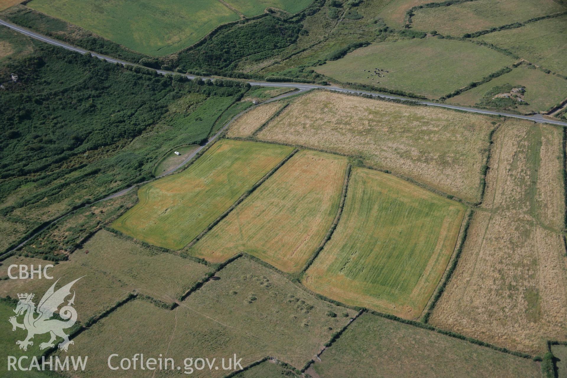 RCAHMW colour oblique aerial photograph of Pont Clegyr Cropmark Enclosure. Taken on 24 July 2006 by Toby Driver.