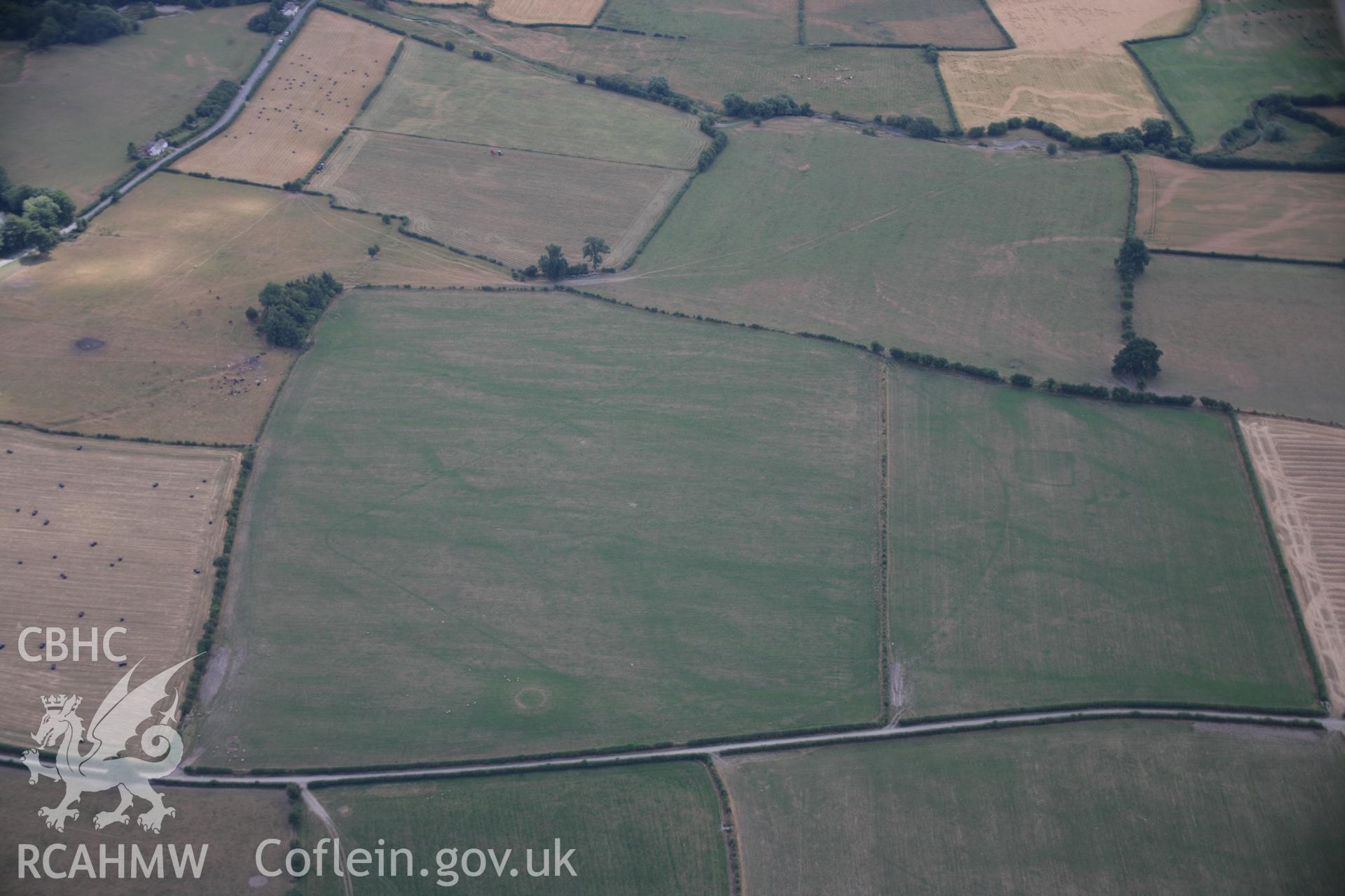 RCAHMW colour oblique aerial photograph of Hindwell Pallisaded Enclosure and Roman Camp. Taken on 27 July 2006 by Toby Driver.