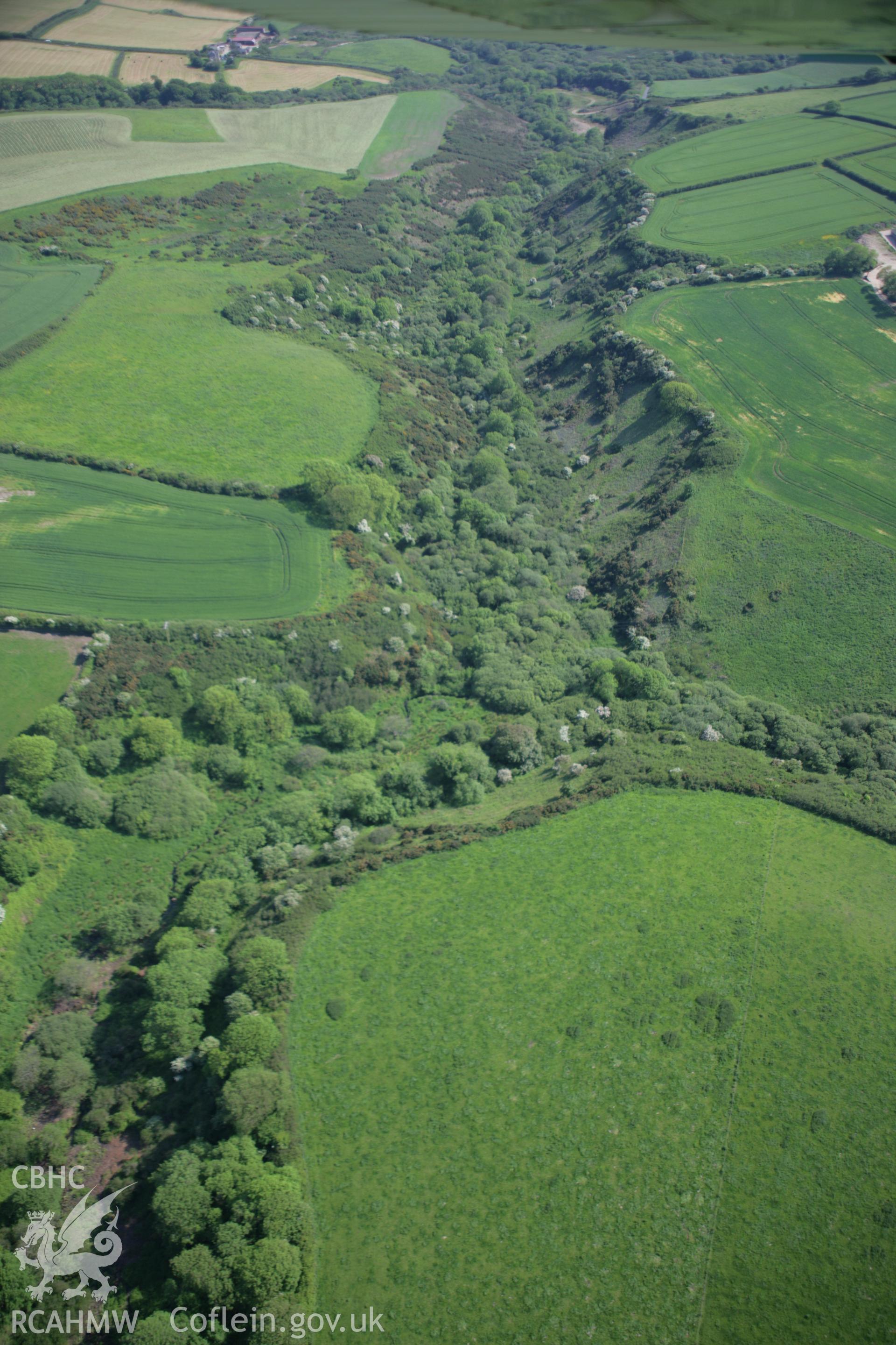 RCAHMW colour oblique aerial photograph of Castle Hill Enclosure, Brandy Brook, Landsker Line, viewed from the north. Taken on 08 June 2006 by Toby Driver