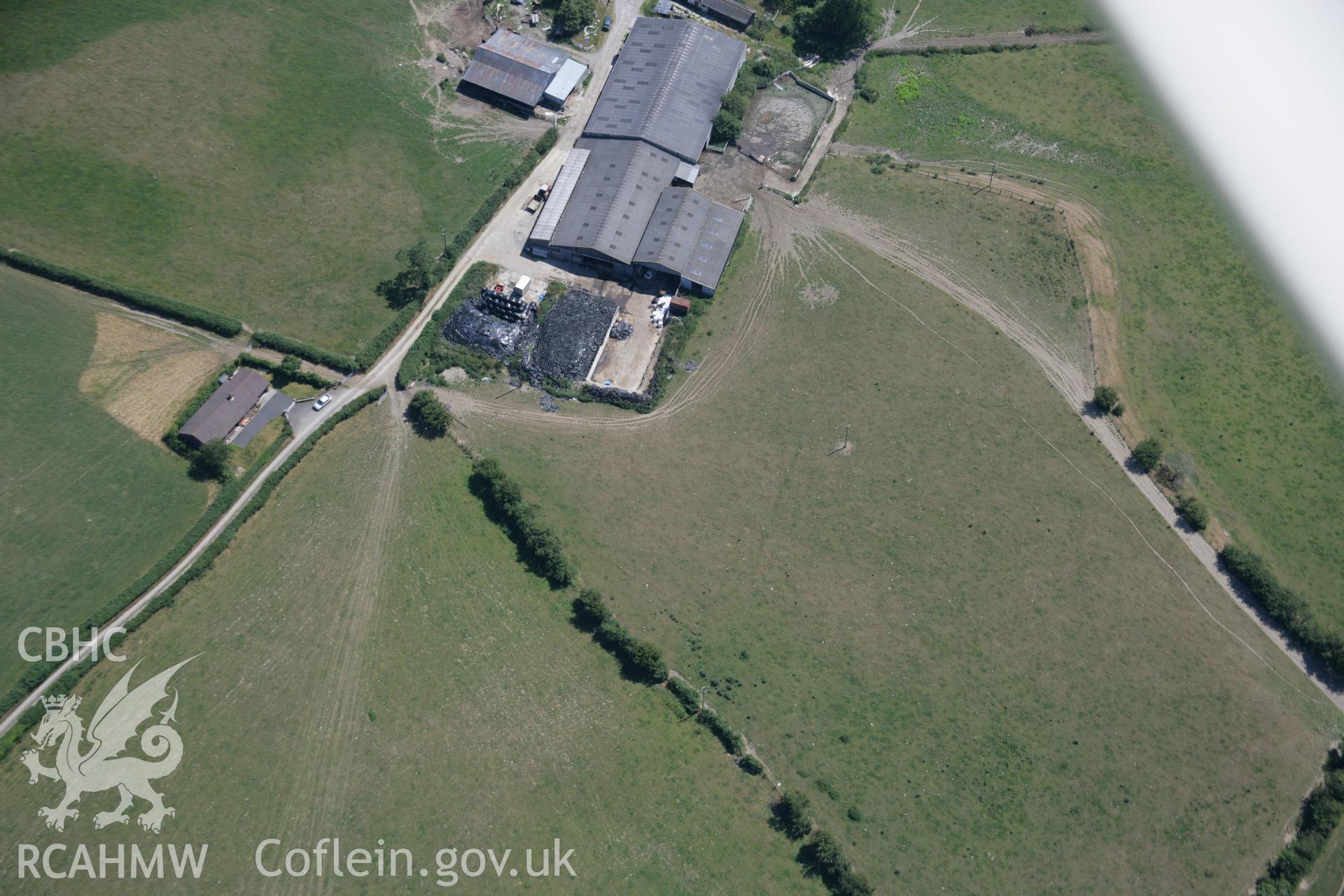 RCAHMW colour oblique aerial photograph of the rectangular enclosure and barrows at Pyllau-Isaf South. Taken on 17 July 2006 by Toby Driver.