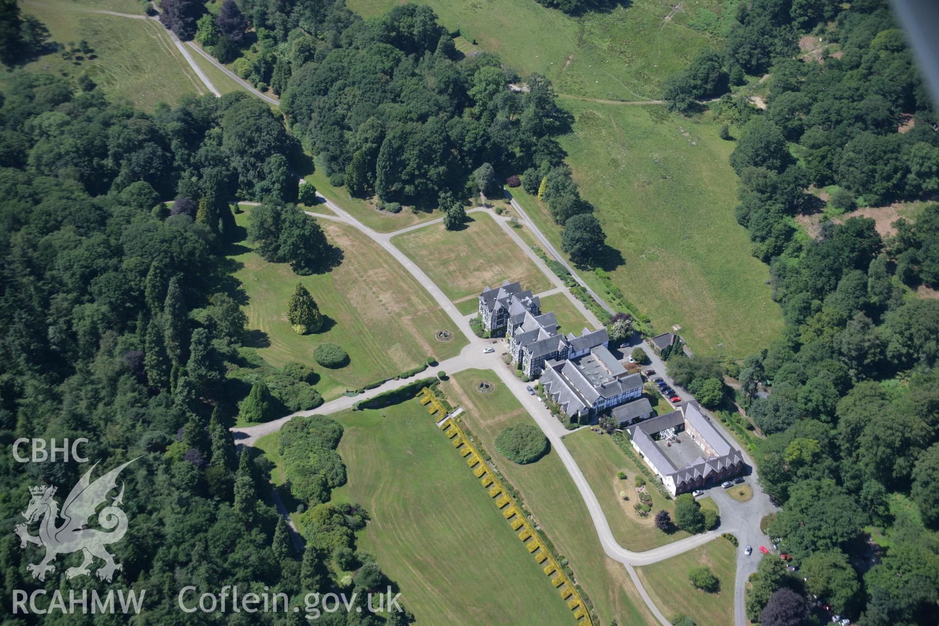 RCAHMW colour oblique aerial photograph of Gregynog Hall Garden, Tregynon, showing parchmarks. Taken on 17 July 2006 by Toby Driver.