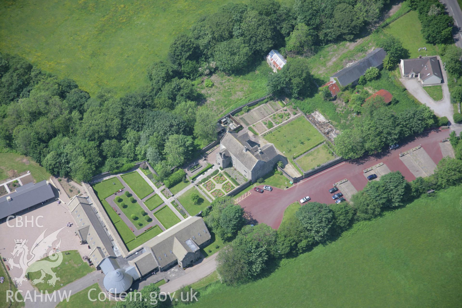 RCAHMW colour oblique aerial photograph of Llancaiach Fawr house, viewed from the south-east. Taken on 09 June 2006 by Toby Driver.