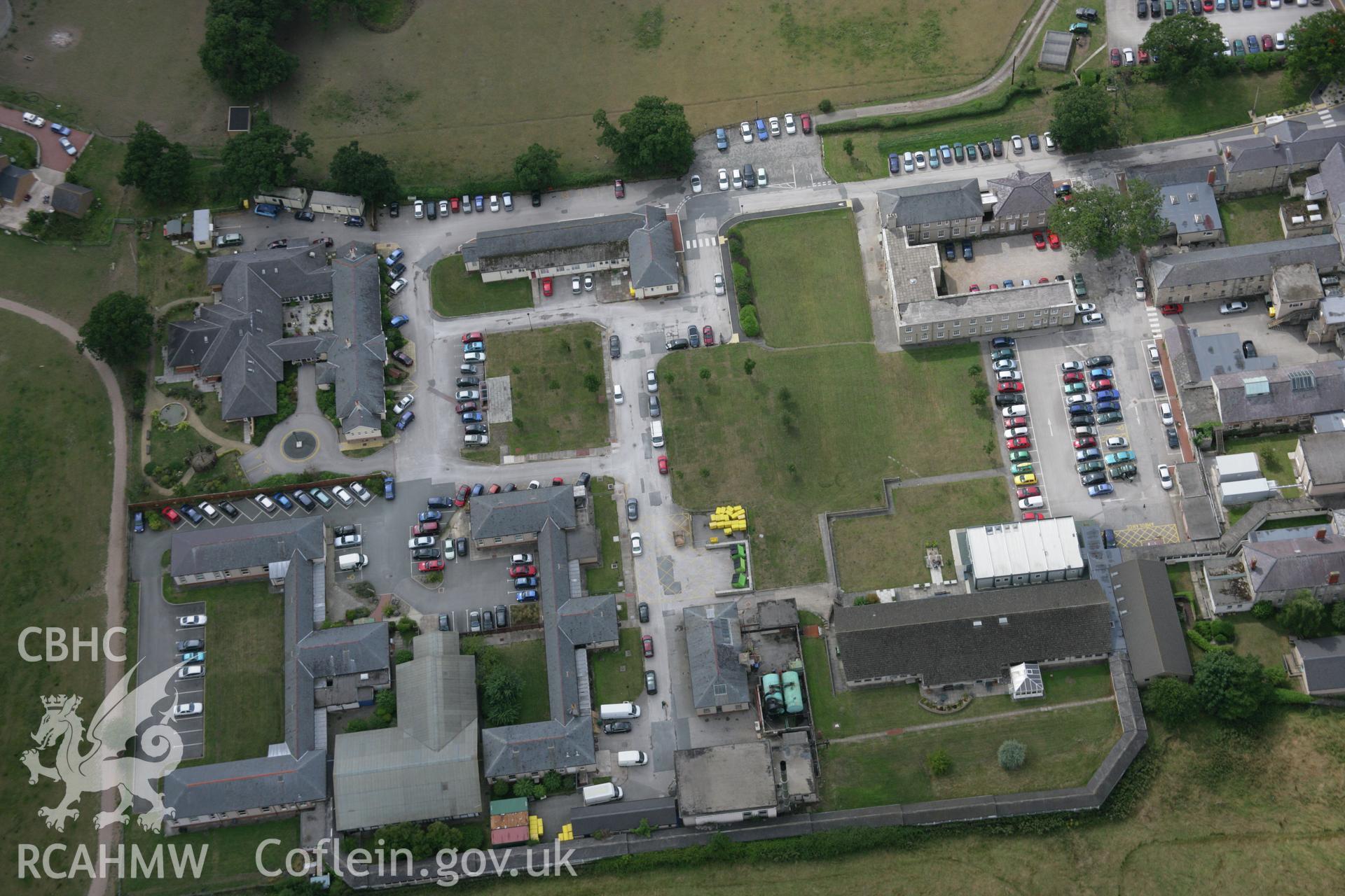 RCAHMW colour oblique aerial photograph of H.M. Stanley Hospital and Chapel showing the parchmarks of buried buildings. Taken on 14 August 2006 by Toby Driver.