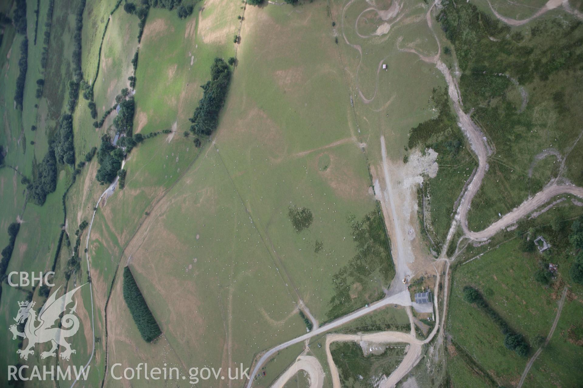 RCAHMW colour oblique aerial photograph of Banc Gelli-Las Roman Road Segment showing as a parchmark. Taken on 27 July 2006 by Toby Driver.