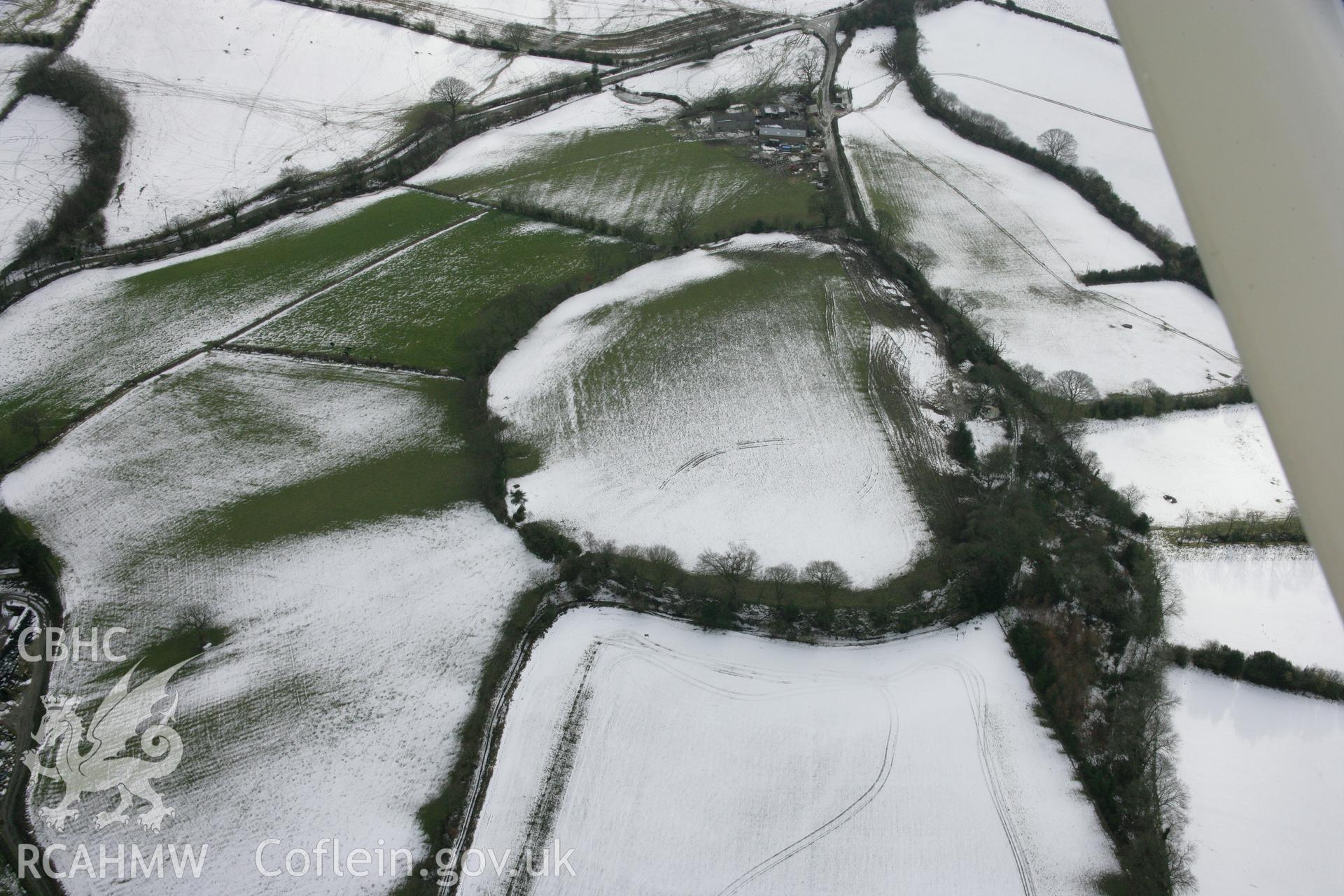 RCAHMW colour oblique aerial photograph of Pen-y-Gaer fort, viewed from the north. Taken on 06 March 2006 by Toby Driver.