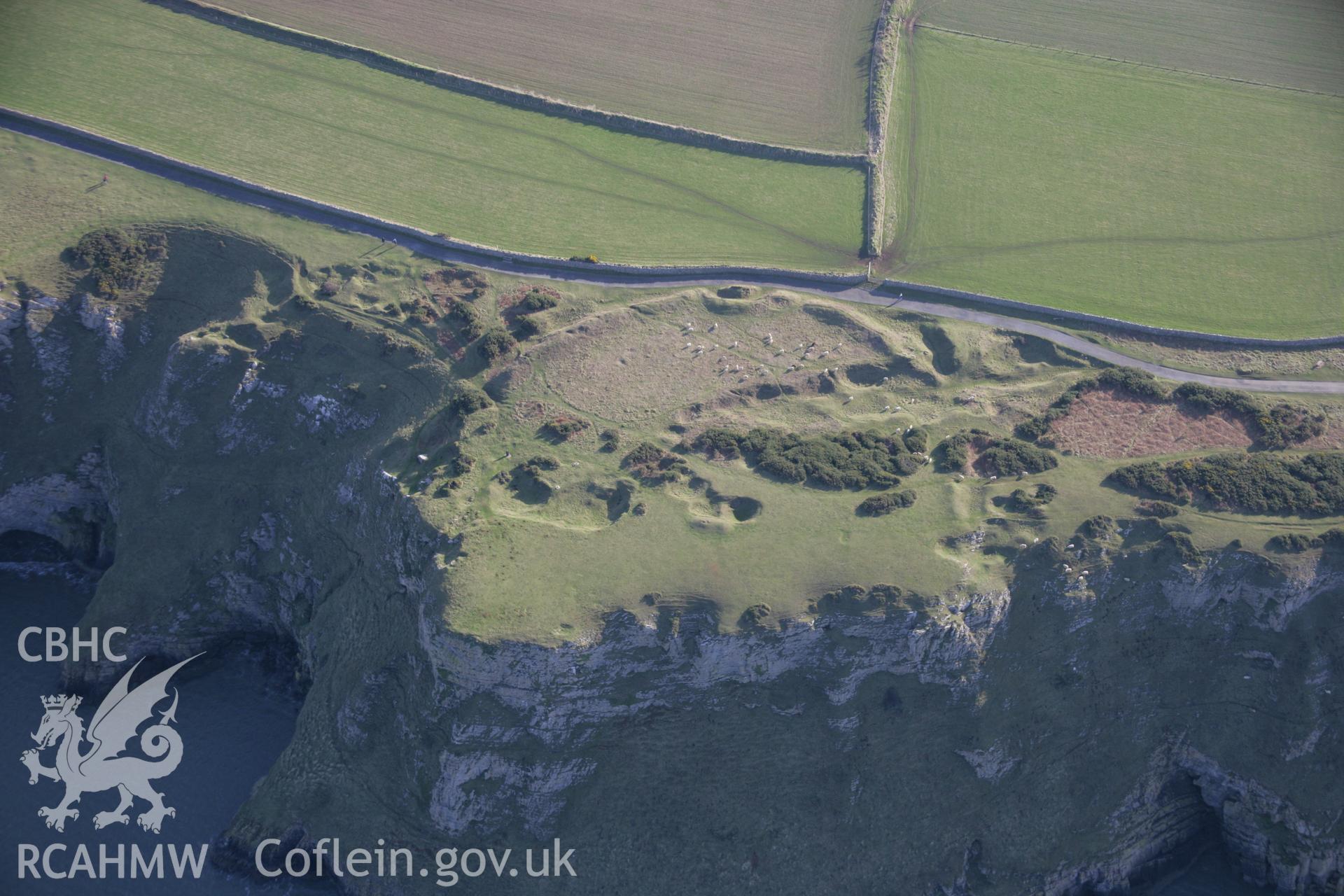 RCAHMW colour oblique aerial photograph of Old Castle Promontory Fort, Rhossili, viewed fomr the north. Taken on 26 January 2006 by Toby Driver.