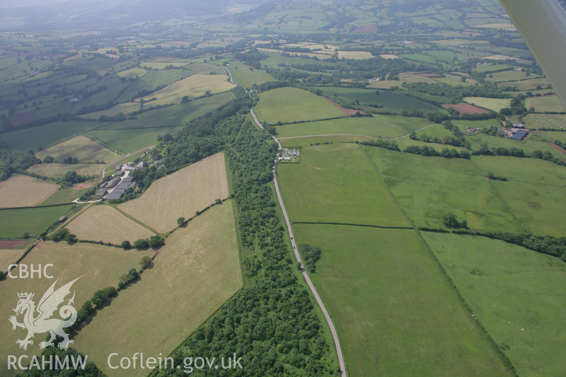 RCAHMW colour oblique photograph of Campston Hill battle site, near Llangattock Lingoed. Taken by Toby Driver on 29/06/2006.