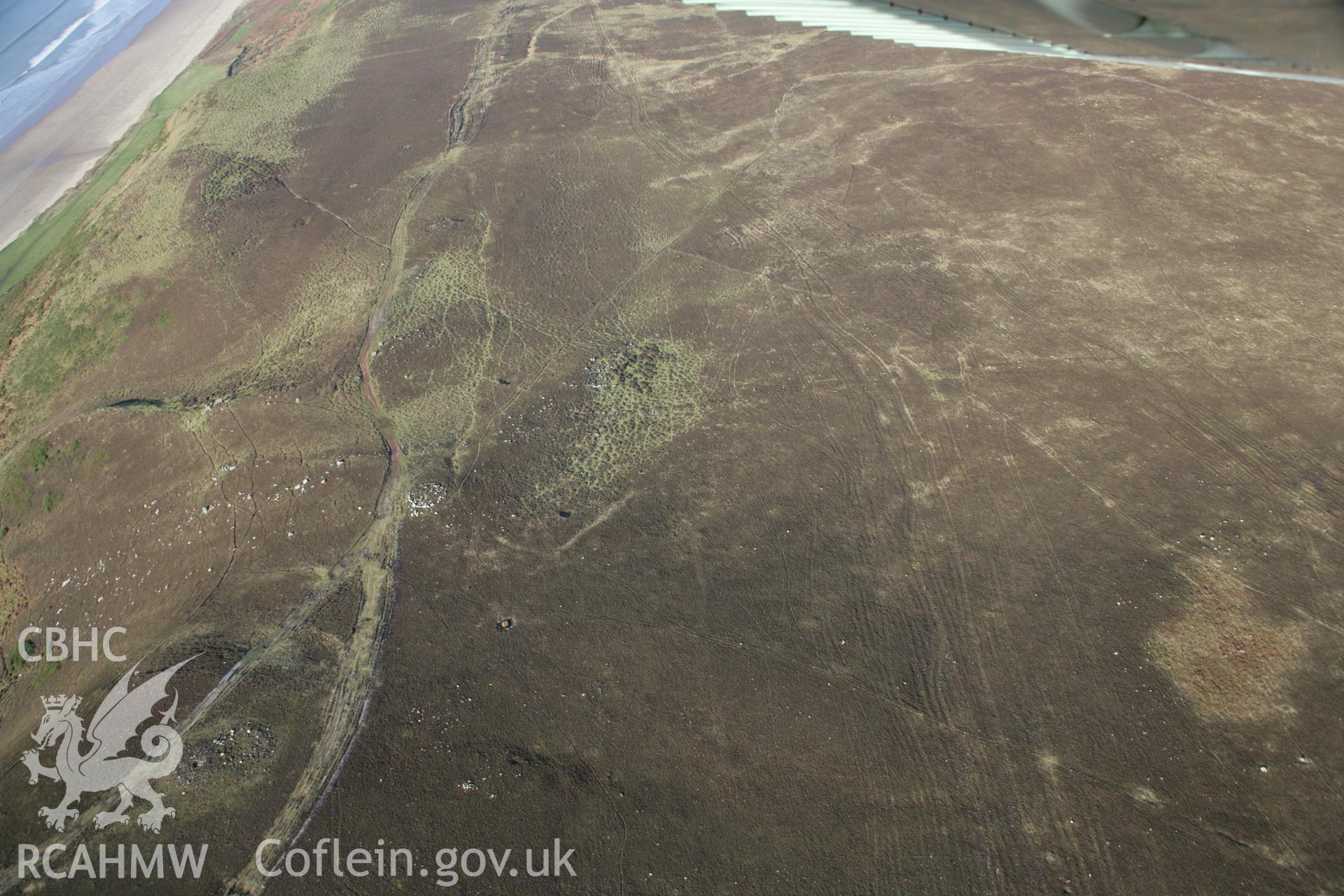 RCAHMW colour oblique aerial photograph of prehistoric field boundary and cairns on Rhossili Down, viewed from the south. Taken on 26 January 2006 by Toby Driver