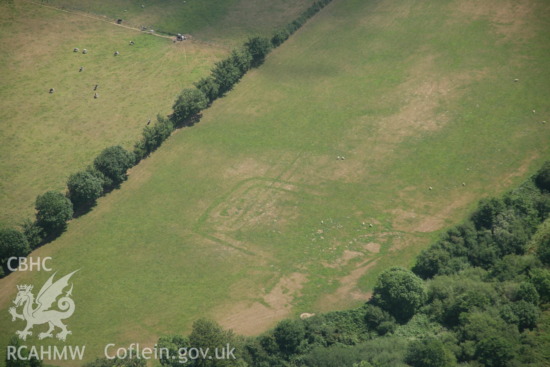 RCAHMW colour oblique aerial photograph of Pont Rhyd-Hir Defended Enclosure, Efailnewydd, from the north-west. Taken on 03 August 2006 by Toby Driver