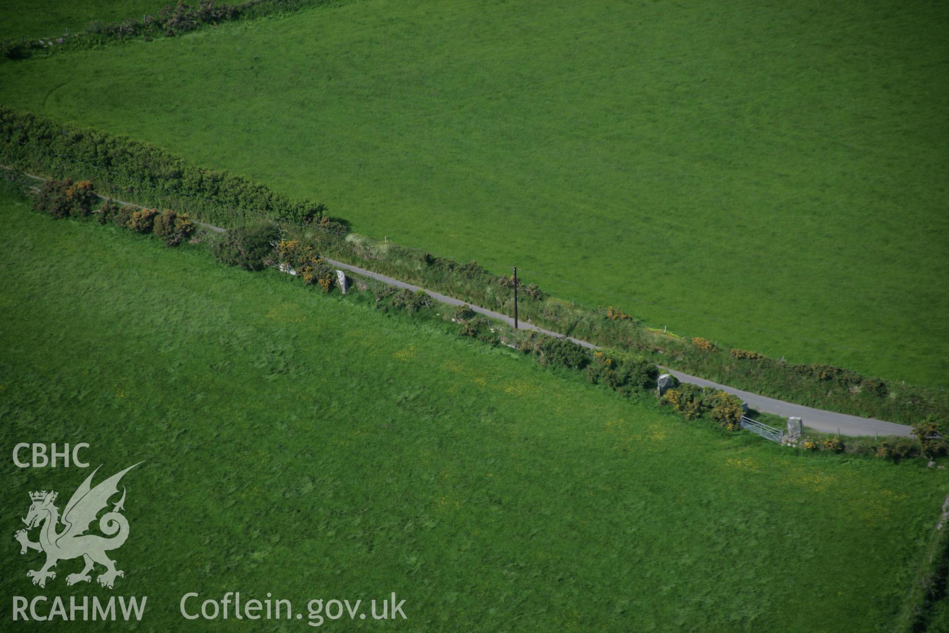 RCAHMW colour oblique aerial photograph of Parc-y-Meirw, Stone Row, viewed from the south. Taken on 08 June 2006 by Toby Driver.