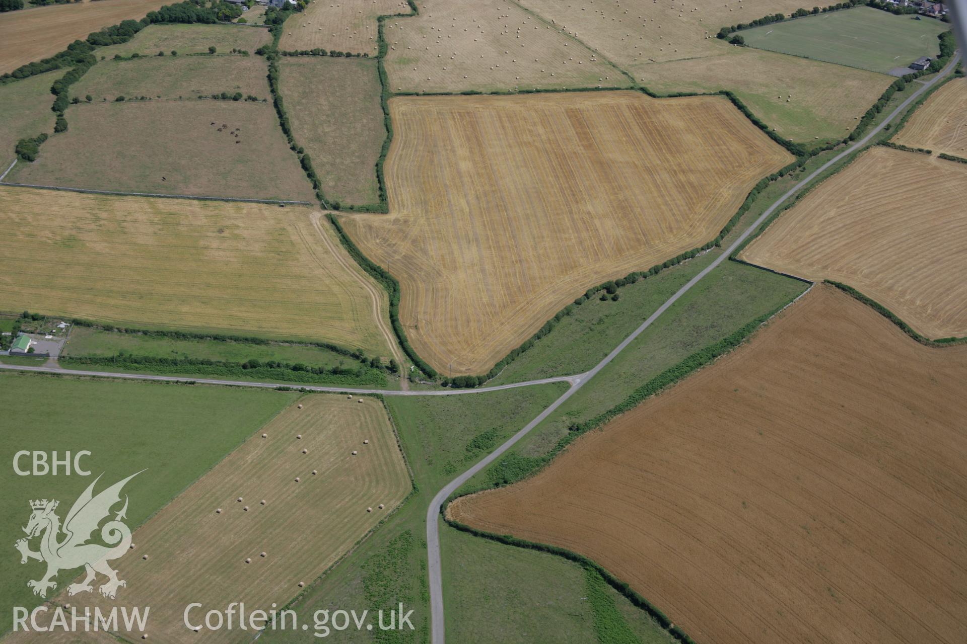 RCAHMW colour oblique aerial photograph of Heol-y-Mynydd Round Barrow. Taken on 24 July 2006 by Toby Driver.