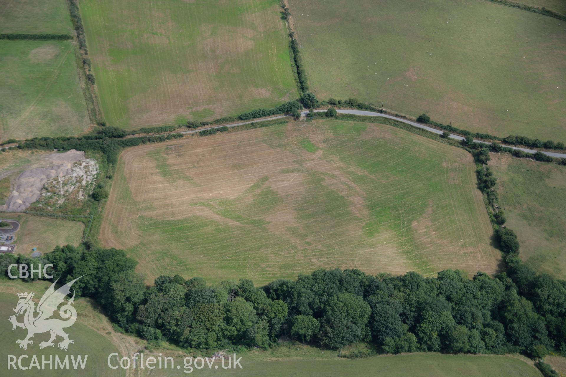 RCAHMW colour oblique aerial photograph of Ty Gwyn Enclosure. Taken on 27 July 2006 by Toby Driver.