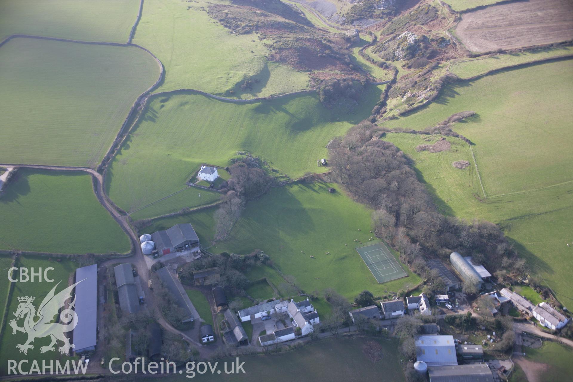 RCAHMW colour oblique aerial photograph of Great Pitton Farmstead and the earthworks of field systems viewed from the north-east. Taken on 26 January 2006 by Toby Driver.