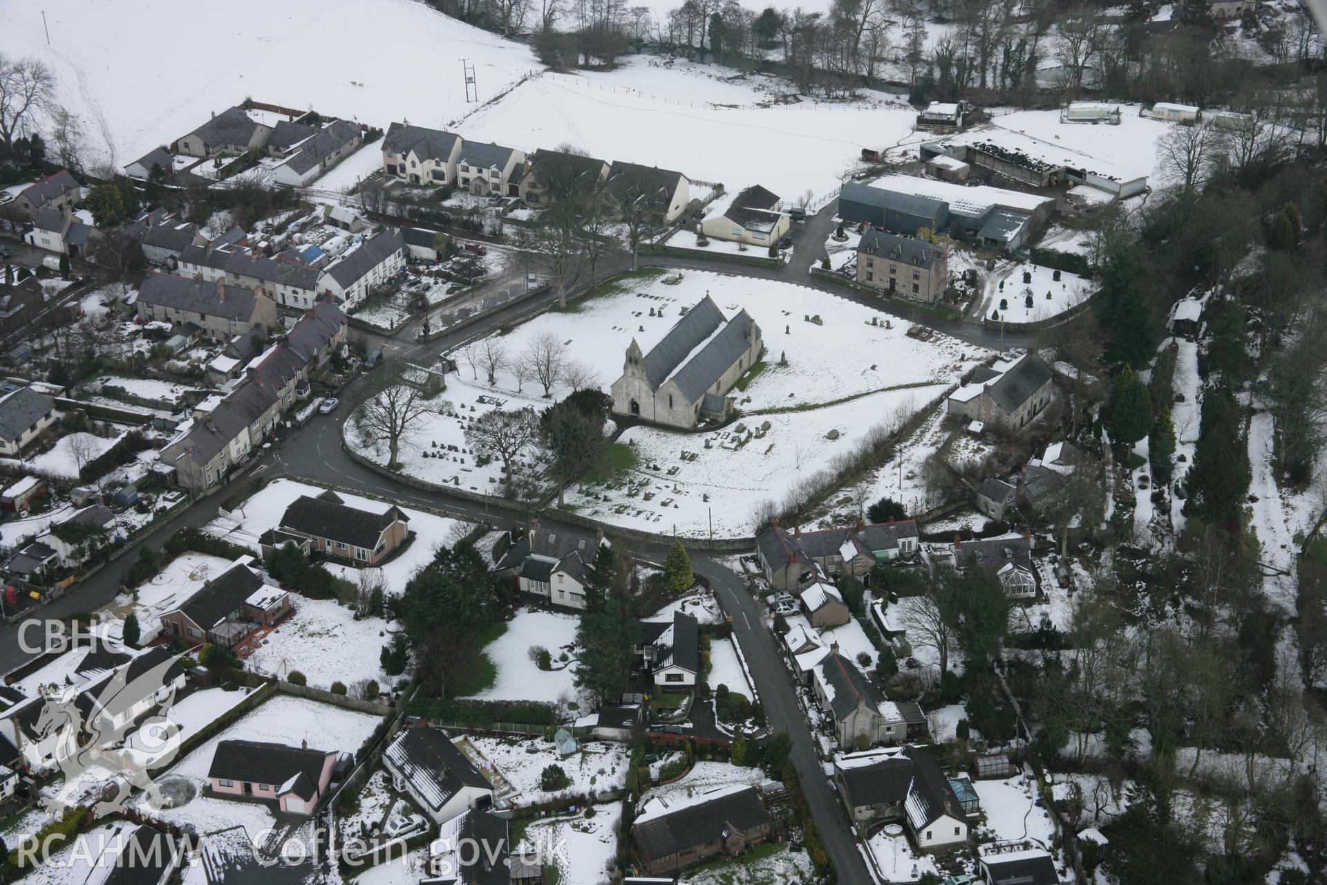 RCAHMW colour oblique aerial photograph of St Garmon's Church, Llanarmon Yn Ial, from the south-west. Taken on 06 March 2006 by Toby Driver.