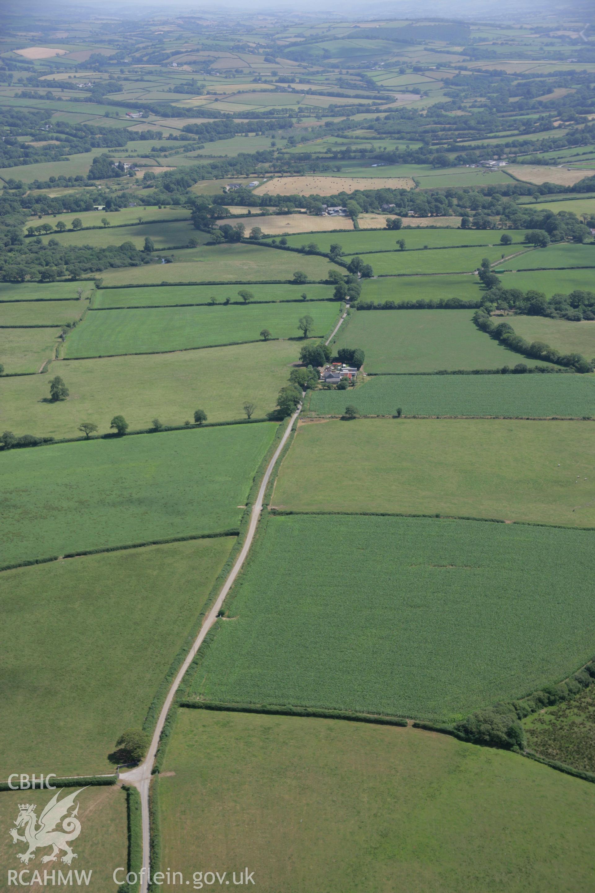 RCAHMW colour oblique aerial photograph of the Roman road west of Carmarthen at Glan-Rhyd. Taken on 24 July 2006 by Toby Driver.