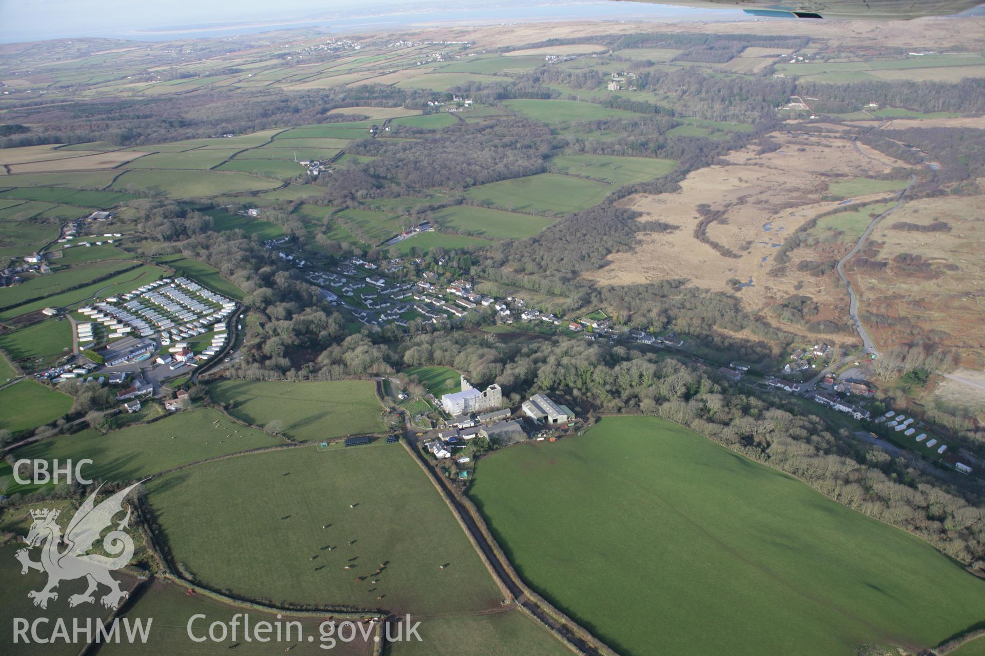 RCAHMW colour oblique aerial photograph of Oxwich Castle, with restoration in progress, in wide view from the south. Taken on 26 January 2006 by Toby Driver.