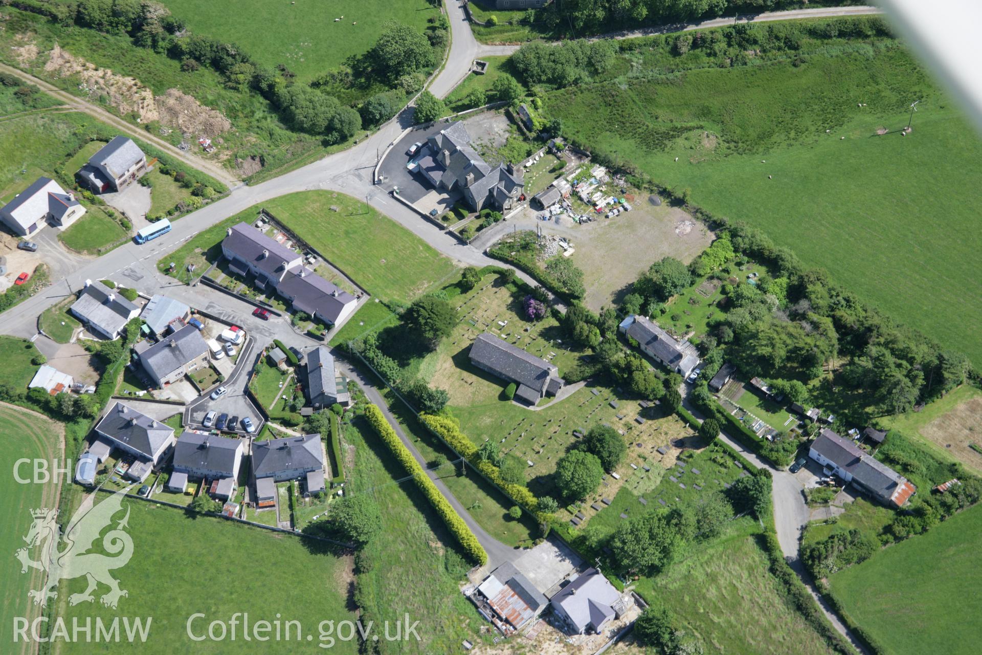 RCAHMW colour oblique aerial photograph of St Mary's Church, Bryncroes, from the north-west. Taken on 14 June 2006 by Toby Driver.