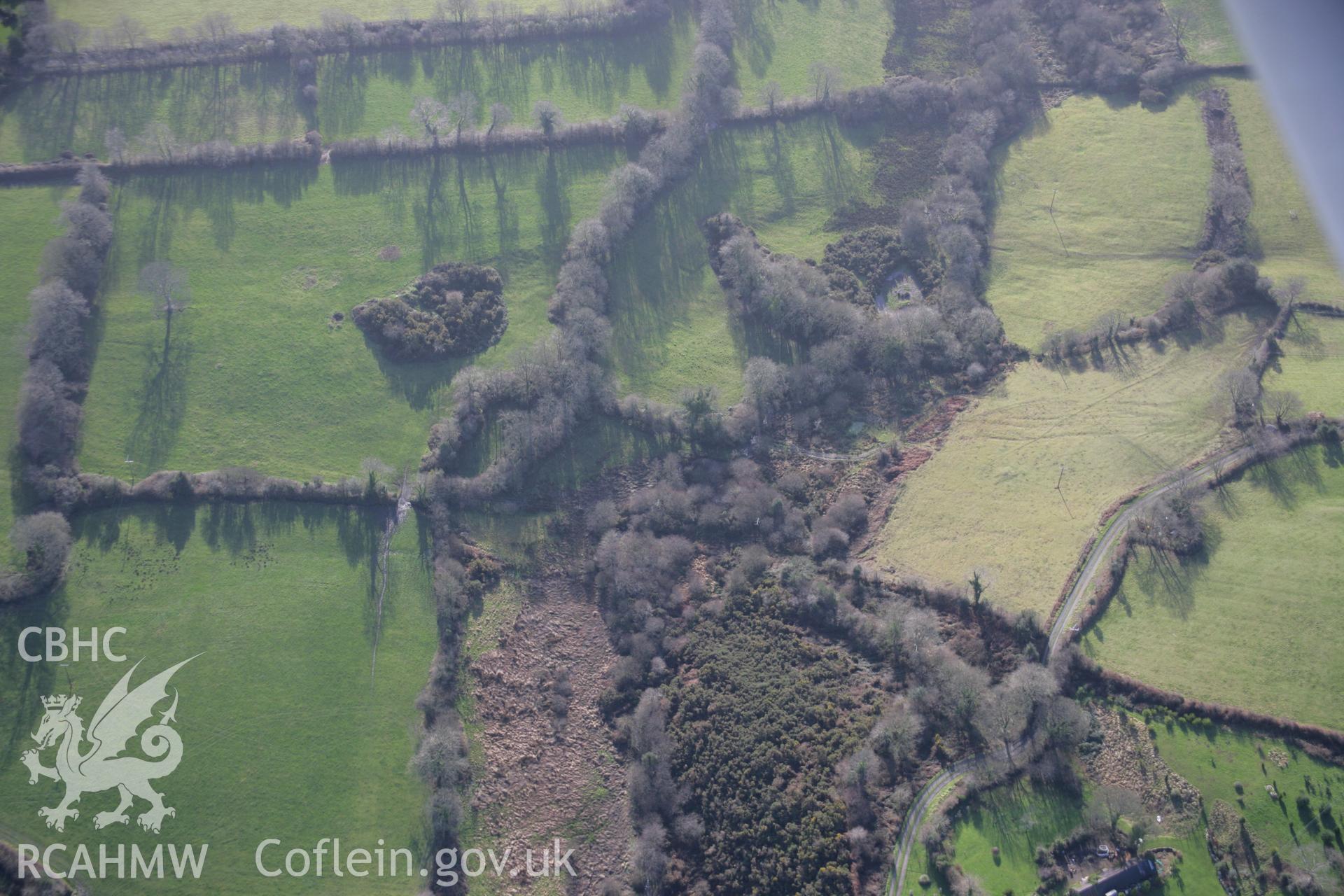 RCAHMW colour oblique aerial photograph of Thomas Chapel Colliery, and the nearby railway embankment, from the north. Taken on 11 January 2006 by Toby Driver