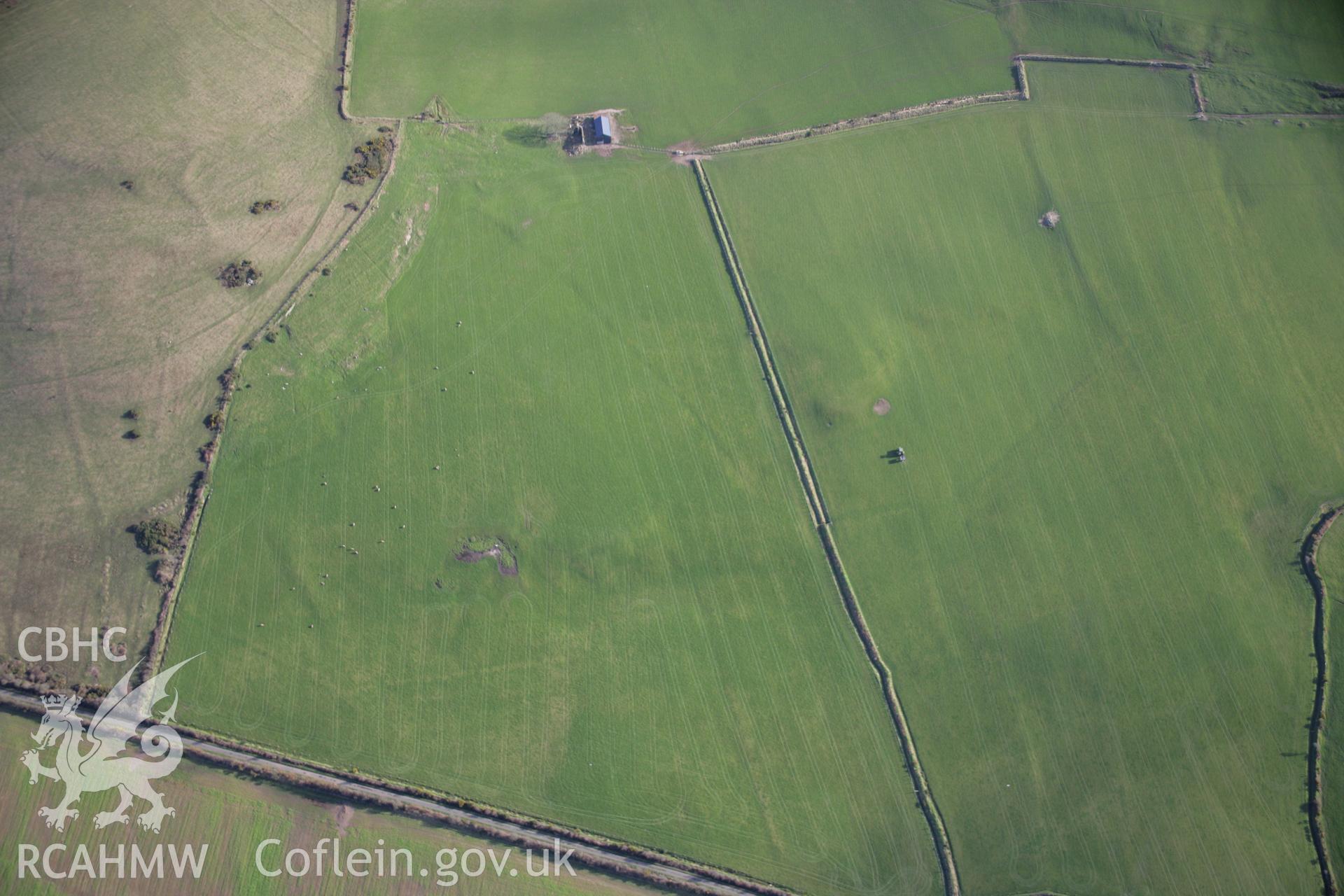 RCAHMW colour oblique aerial photograph of Castell Odo from the north-west showing field systems to the west of the fort. Taken on 09 February 2006 by Toby Driver.