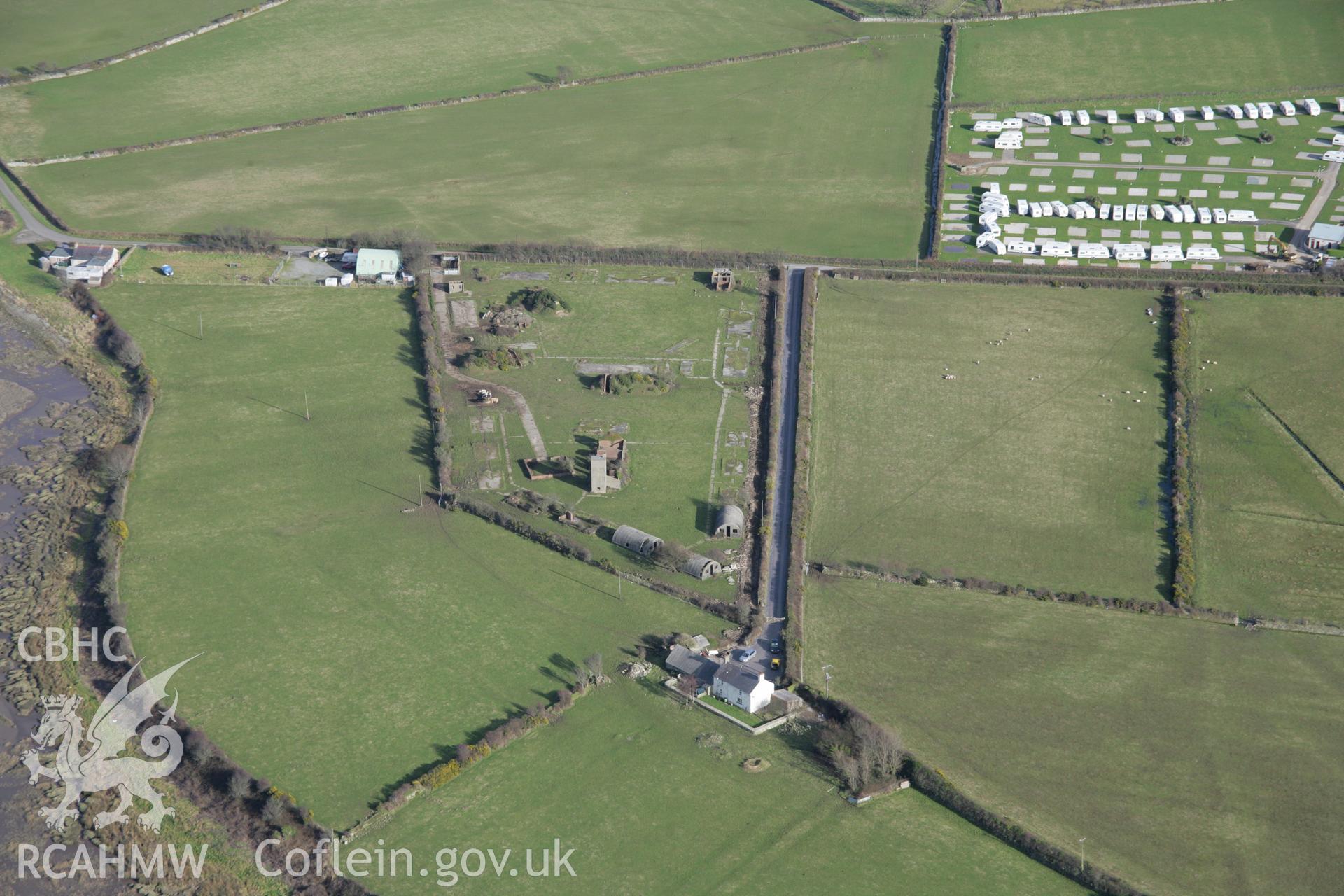 RCAHMW colour oblique aerial photograph of Blythe Farm RAF Regiment Barracks from the south-west. Taken on 09 February 2006 by Toby Driver.