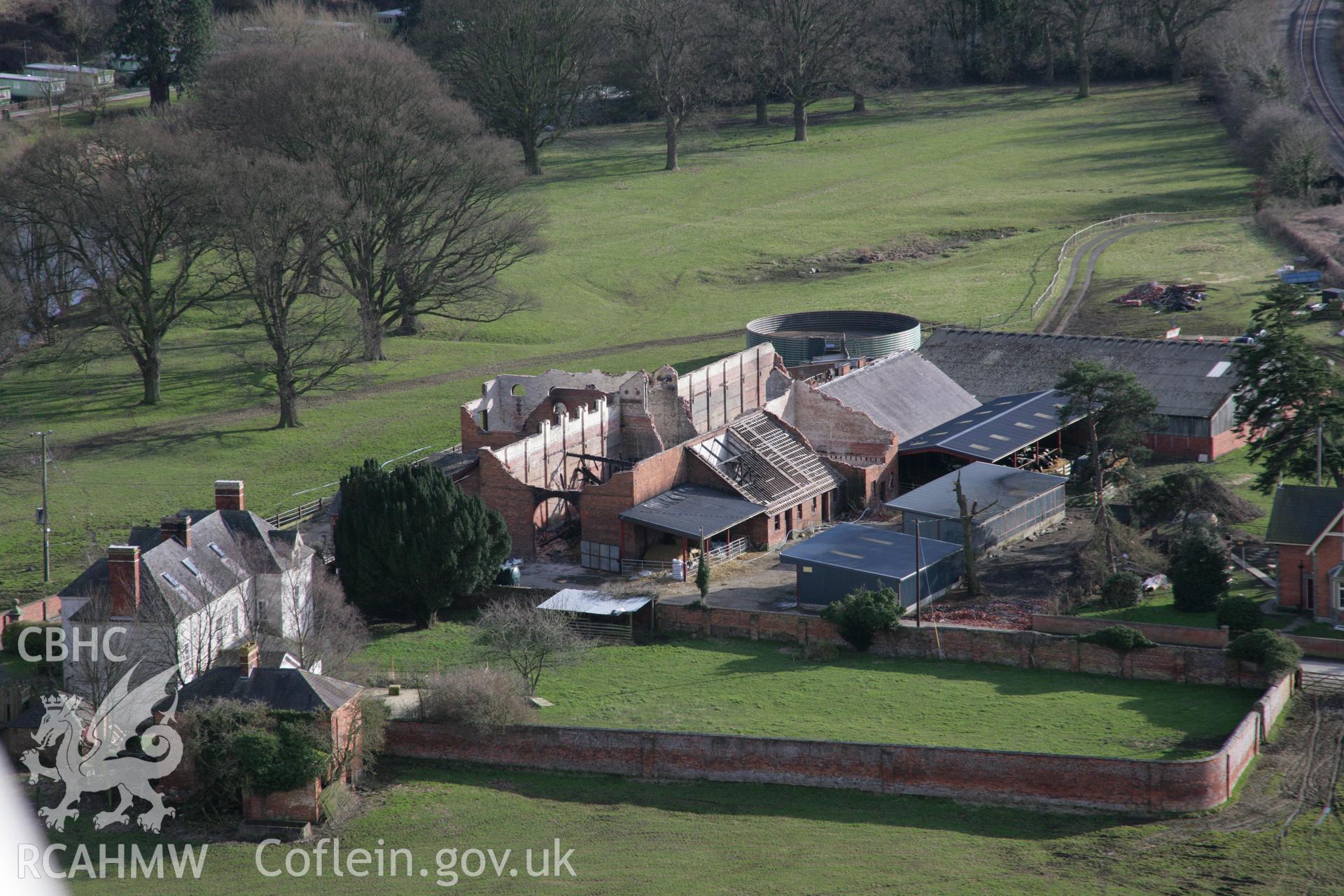 RCAHMW colour oblique aerial photograph of the demolished Glanhafren Great Barn, Leighton Estate, from the north, whilst a ruin following a fire. Taken on 06 March 2006 by Toby Driver.